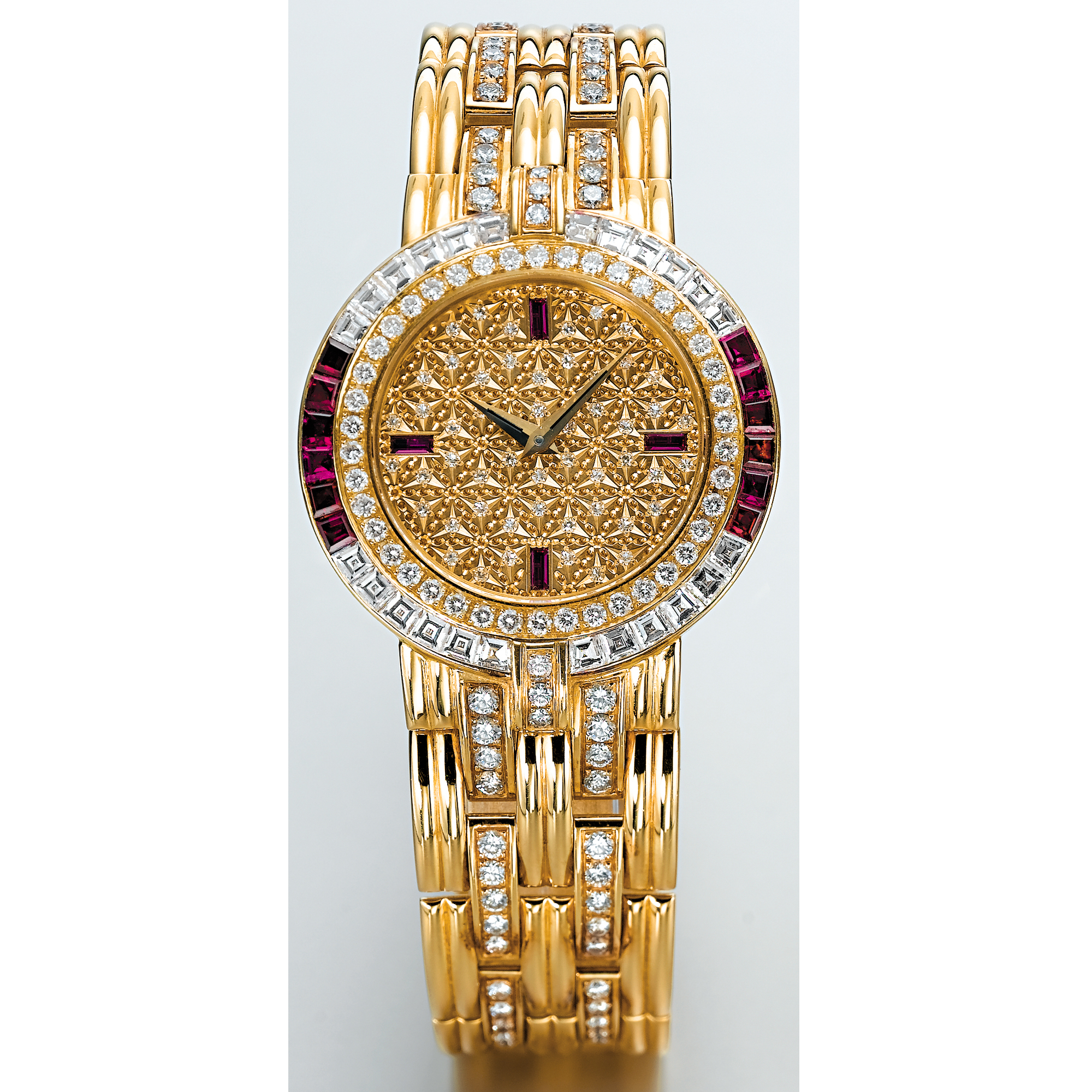PATEK PHILIPPE, A GOLD, DIAMOND AND RUBY SET RECTANGULAR BRACELET WATCH CIRCA 1990 REF 3833 MVT NO 1549218 CASE NO 2855888