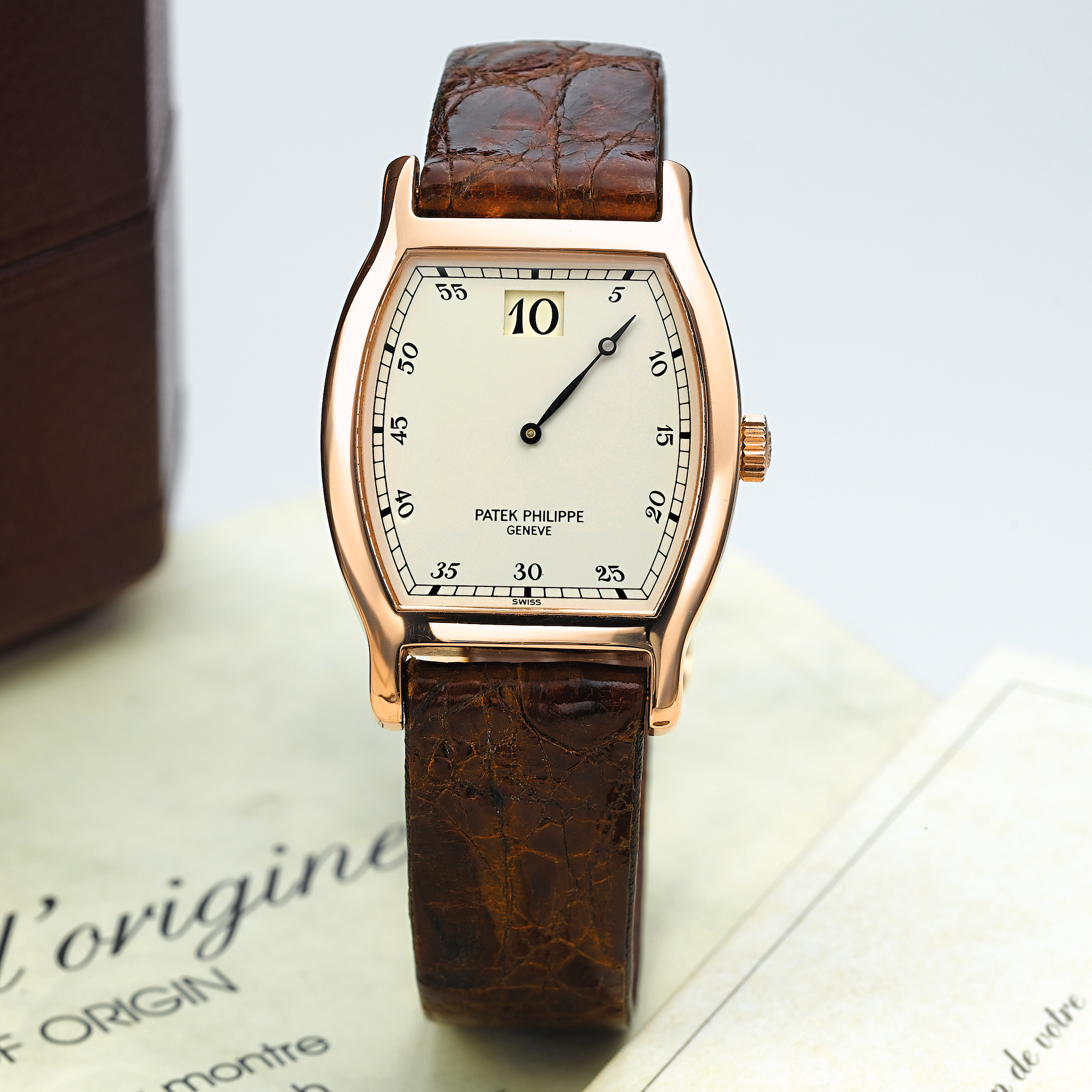 Patek Philippe, A FINE LIMITED EDITION PINK GOLD TONNEAU JUMP HOUR WRISTWATCH CIRCA 1989 RED 3969R MVT 752944 CASE 2864857
