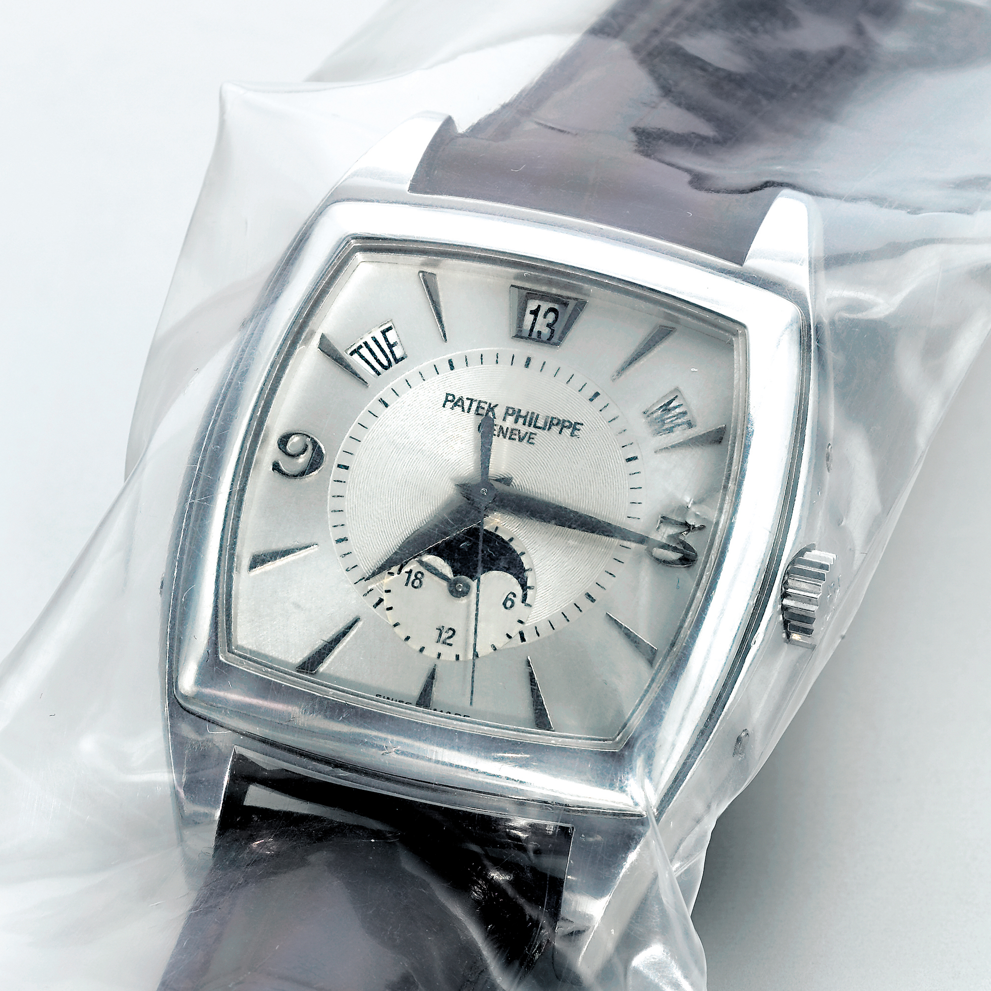 PATEK PHILIPPE, A FINE AND RARE WHITE GOLD CUSHION AUTOMATIC ANNUAL CALENDAR SWEEP SECONDS WRISTWATCH WITH 24 HOURS INDICATION AND MOON-PHASESCIRCA 2005 REF 5135G GONDOLO CALENDARIO MVT 3425859