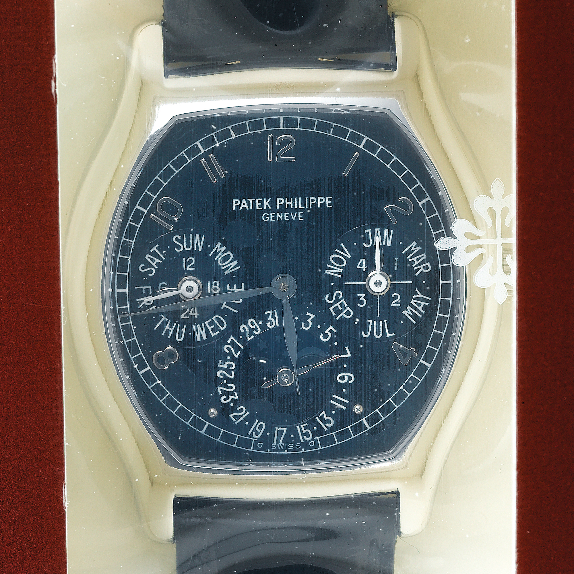 PATEK PHILIPPE, A FINE PLATINUM TONNEAU AUTOMATIC PERPETUAL CALENDAR WRISTWATCH WITH MOON-PHASESCIRCA 1995 REF 5040P MVT 3128495 CASE 4316869