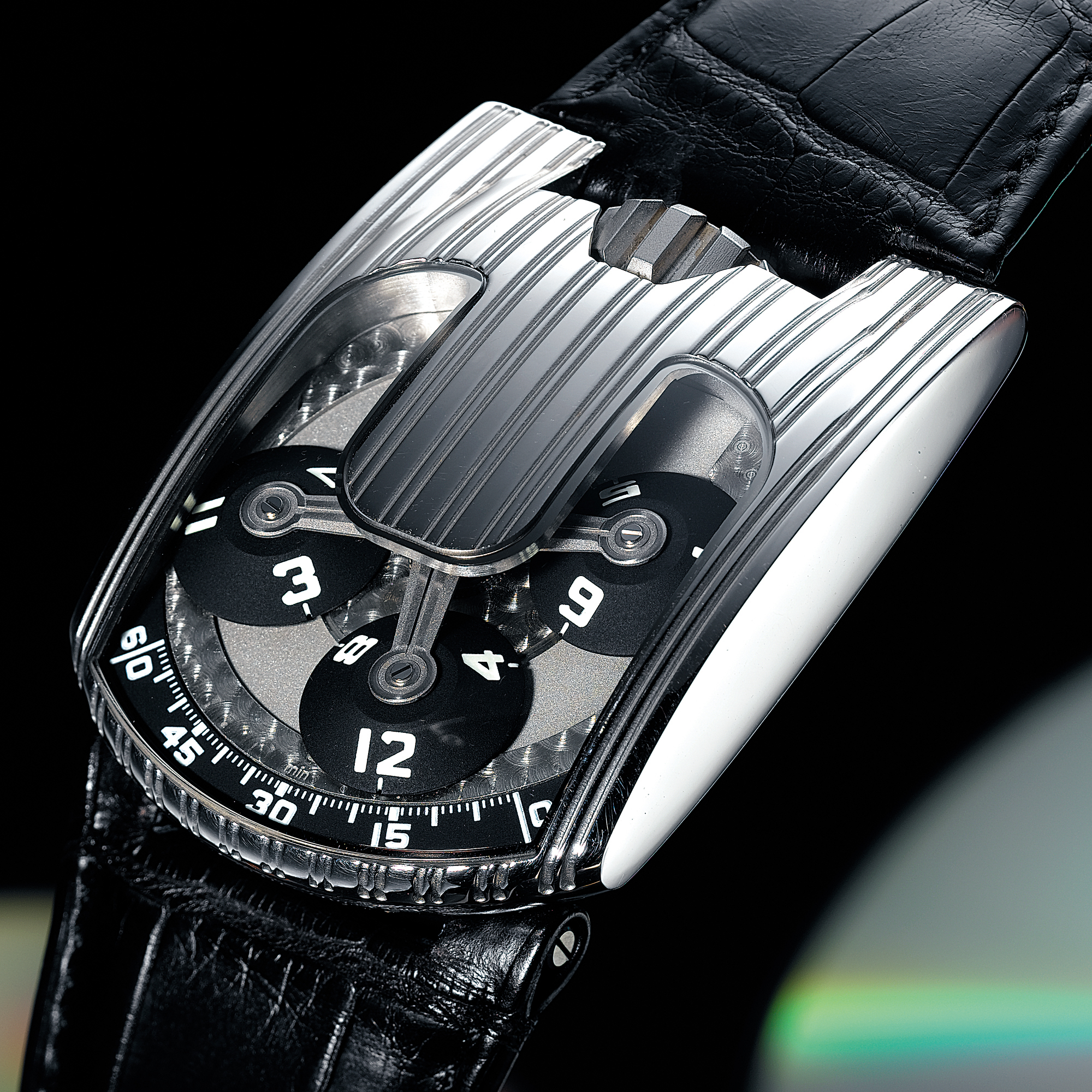 URWERK, A FINE, RARE AND UNUSUAL LIMITED EDITION PLATINUM AREODYNAMIC WRISTWATCH WITH SATELLITE HOUR DISPLAY, CONTROL BOARD AND POWER RESERVECIRCA 2005 REF 10303 NO 3/25