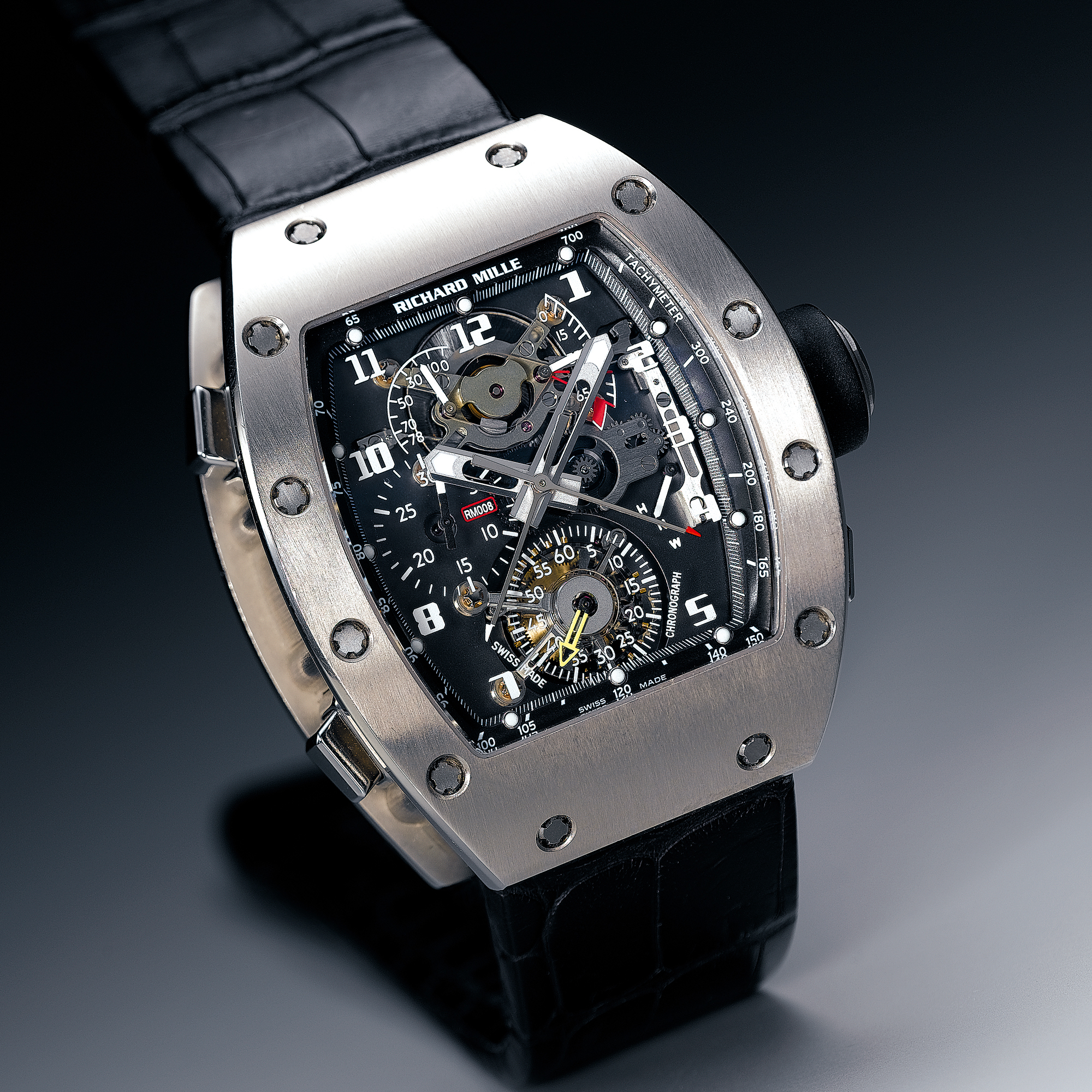 RICHARD MILLE, A RARE AND UNUSUAL WHITE GOLD CURVED TONNEAU SPLITSECONDS CHRONOGRAPH WRISTWATCH WITH ONE-MINUTE TOURBILLON, POWER RESERVE AND TORQUE INDICATOR DISPLAY CIRCA 2003 RM008-1