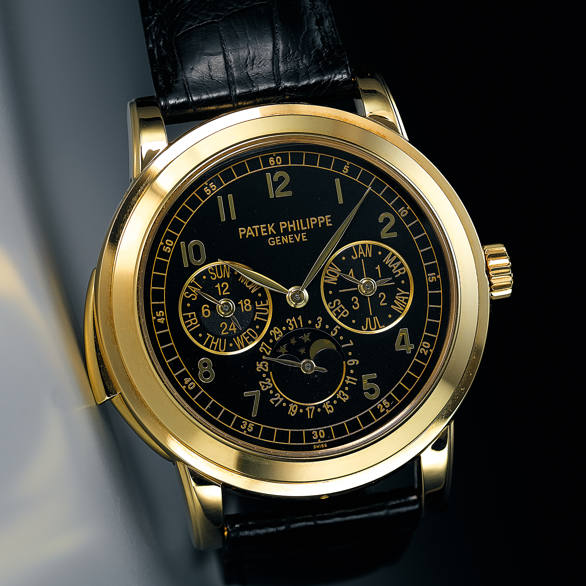Patek Philippe, A VERY RARE AND IMPORTANT OVERSIZED GOLD AUTOMATIC MINUTE REPEATING PERPETUAL CALENDAR WRISTWATCH WITH BLACK DIAL, MOON-PHASES AND LEAP YEAR INDICATORSCIRCA 2002 REF 5074 MVT 190151