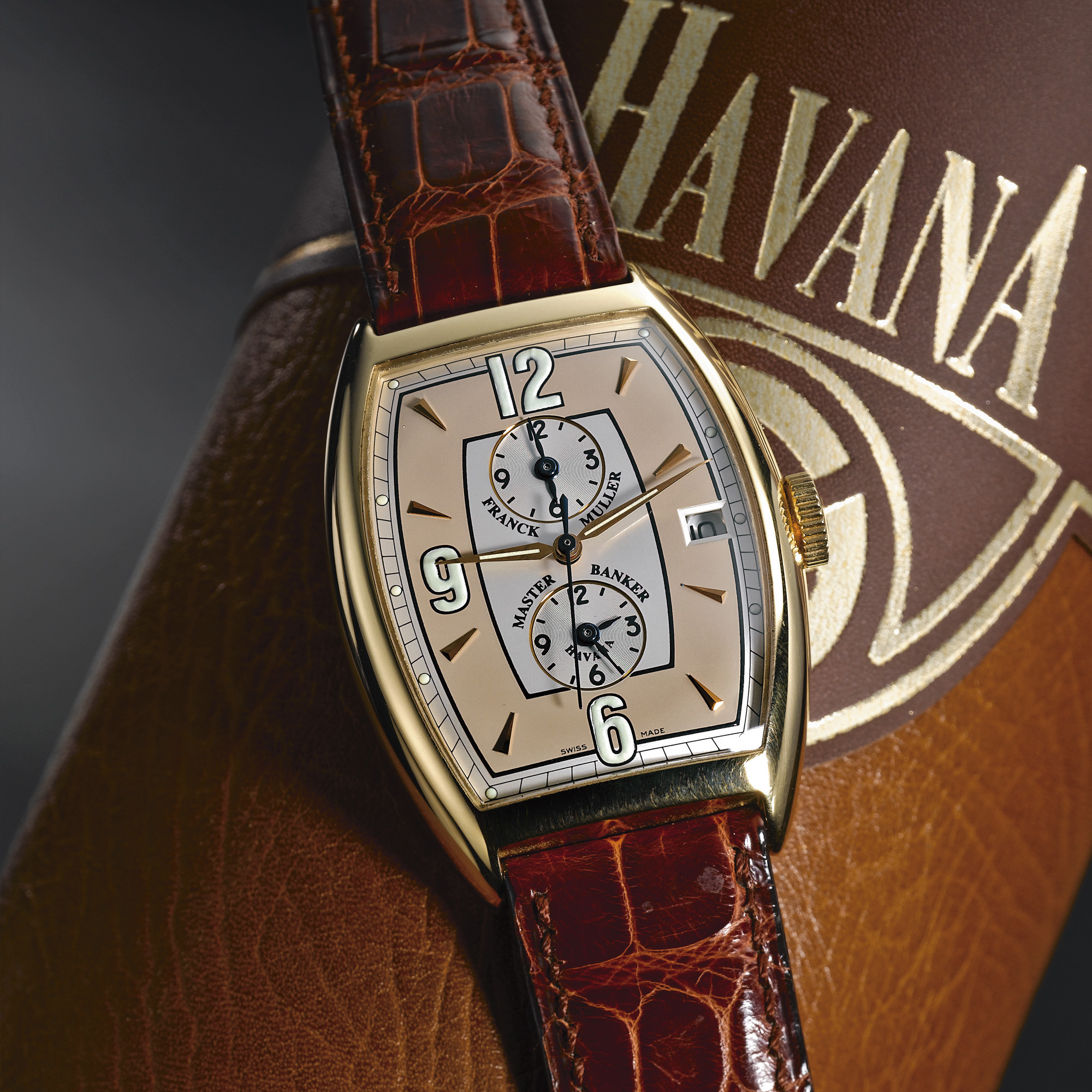 Franck Muller, A GOLD TONNEAU FORM AUTOMATIC CENTER SECONDS TRIPLE TIME ZONE WRISTWATCH WITH DATE CIRCA 2000 REF 6850 MB HV MASTER BANKER HAVANA N0 25