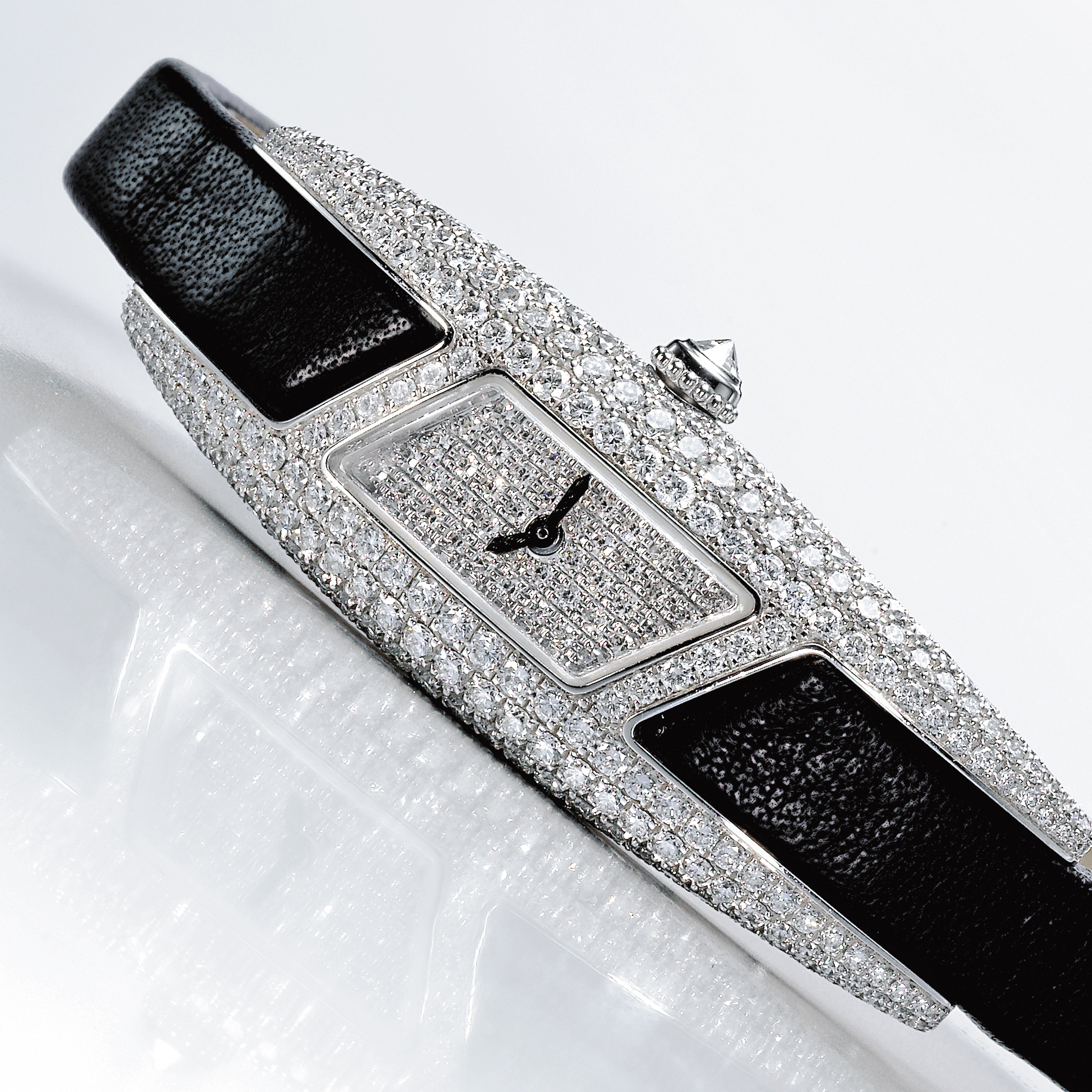 Cartier,  A LADY'S FINE WHITE GOLD AND DIAMOND SET ELONGATED FANCY FORM WRISTWATCH CIRCA 2007