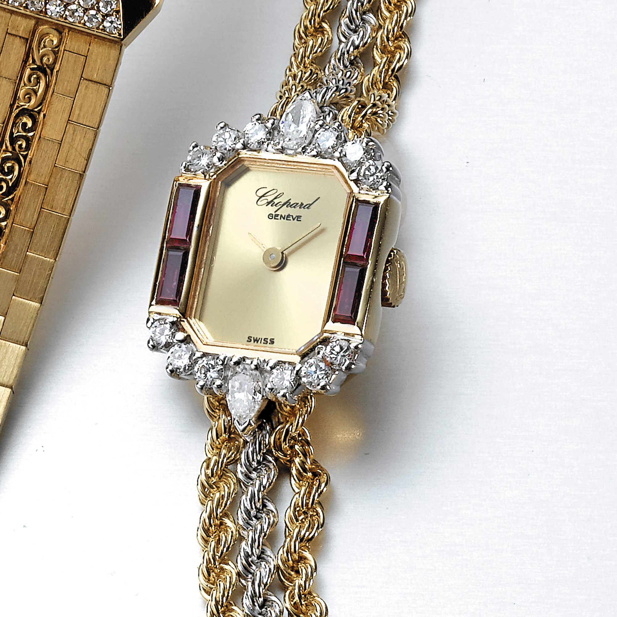 Chopard,  A LADY'S TWO-COLOUR GOLD, RUBY AND DIAMOND-SET BRACELET WATCH CIRCA