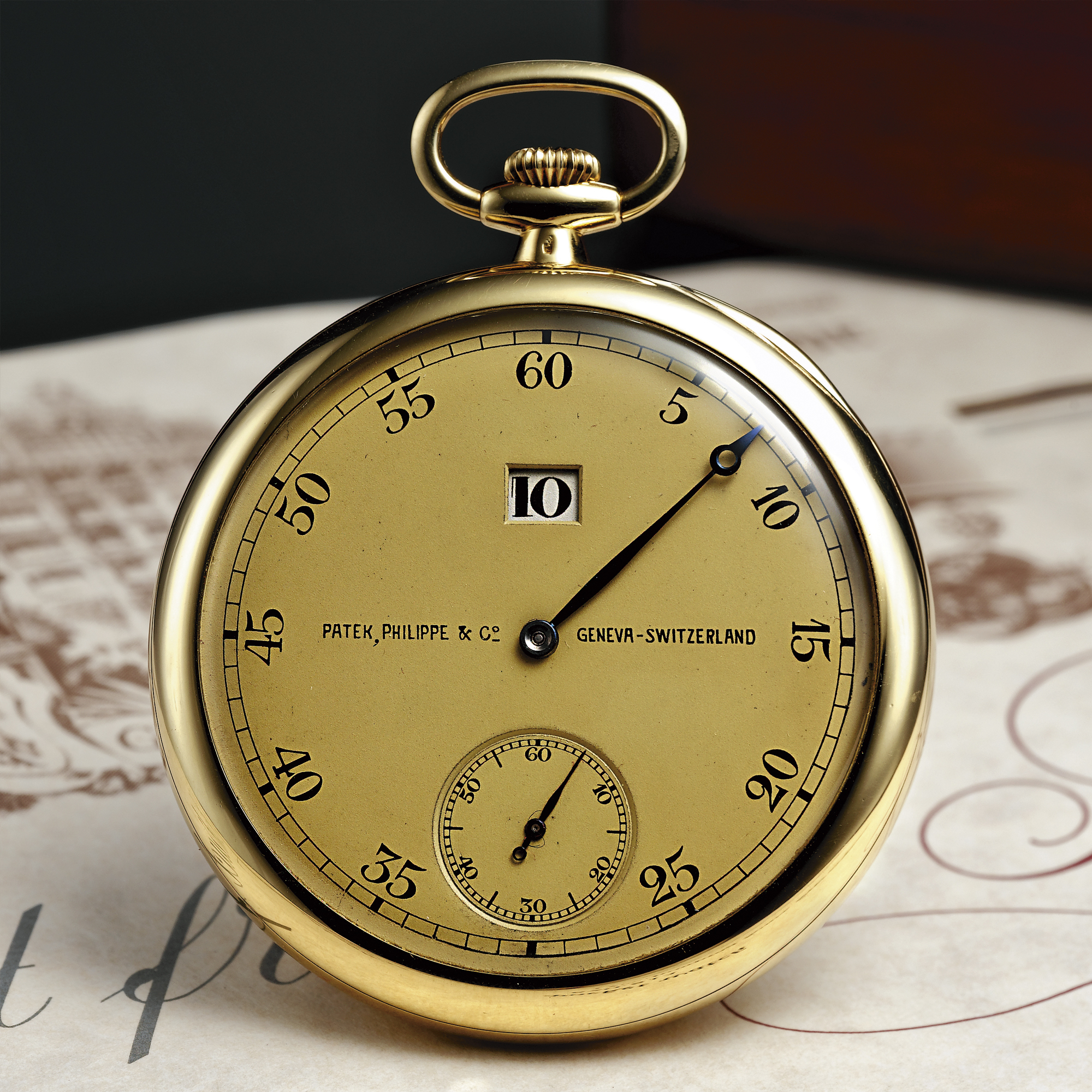 PATEK PHILIPPE, A FINE AND VERY RARE GOLD JUMP HOUR KEYLESS LEVER OPEN-FACED WATCH CIRCA 1928 MVT 820813 CASE 415807