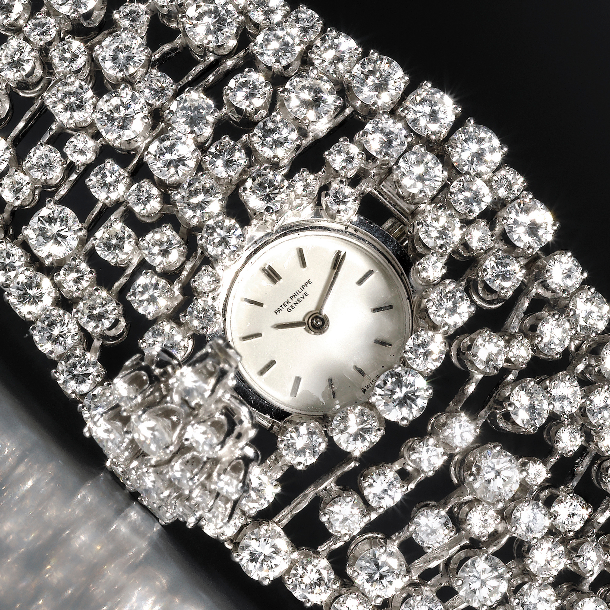 Patek Philippe, AN EXCEPTIONALLY FINE LADY'S ONLY KNOWN PLATINUM AND DIAMOND SET BRACELET WATCH WITH CONCEALED DIALCIRCA 1974 REF 3382/1P RIVIERE MVT 1248640 CASE 2634594