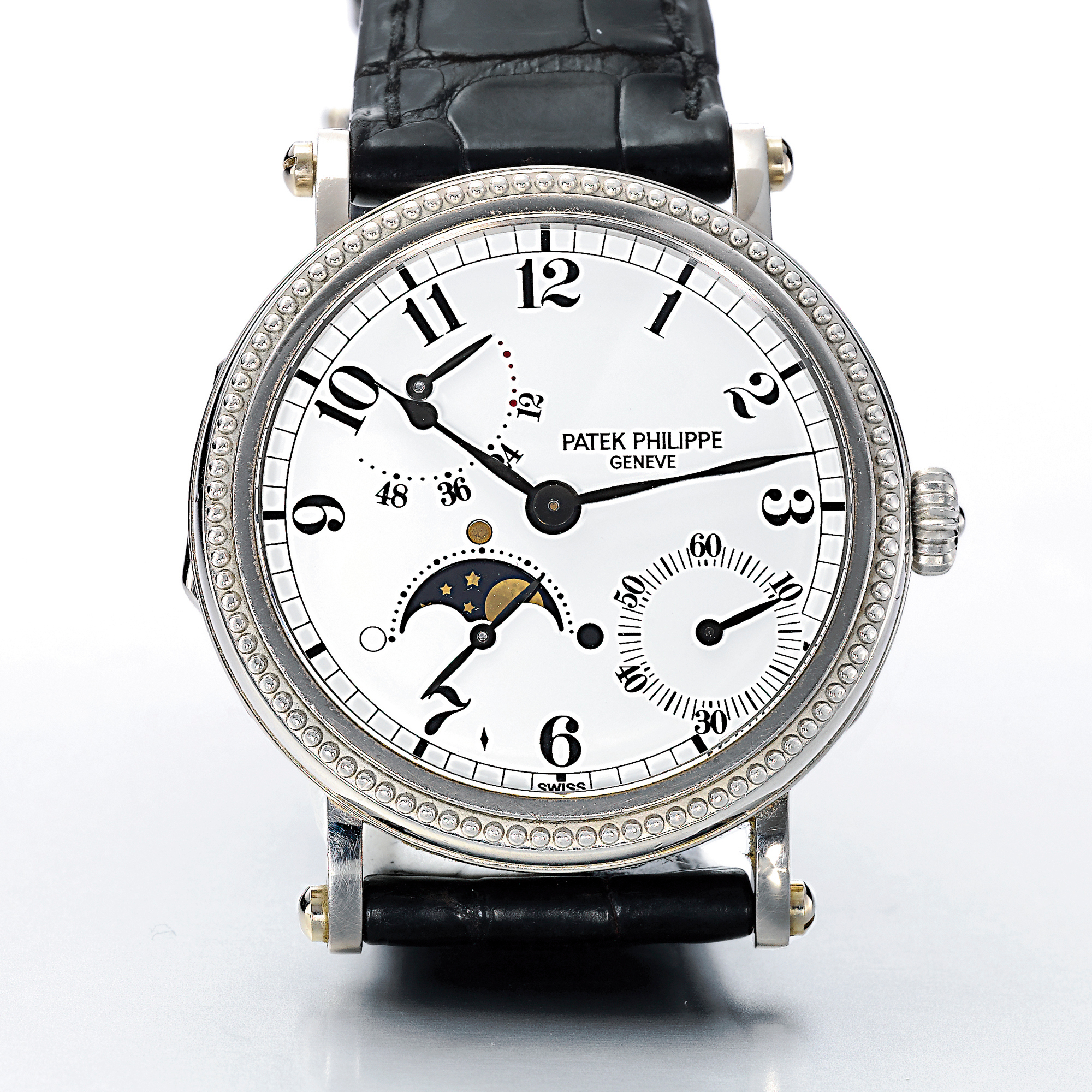 Patek Philippe, A FINE WHITE GOLD AUTOMATIC WRISTWATCH WITH MOON-PHASES AND POWER RESERVE INDICATION CIRCA 1995 REF 5015G MVT 1959852 CASE 2968046 
