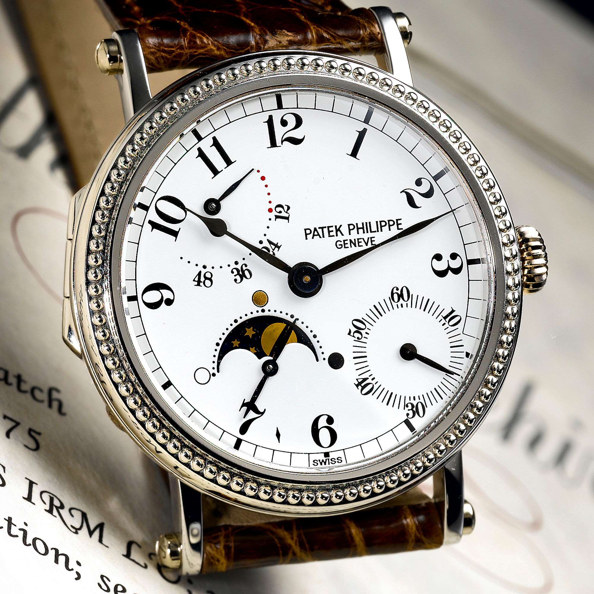 Patek Philippe, A FINE PLATINUM AUTOMATIC WRISTWATCH WITH MOON-PHASES AND POWER RESERVE INDICATION CIRCA 1996 REF 5015P MVT 30516675 CASE 2993778 