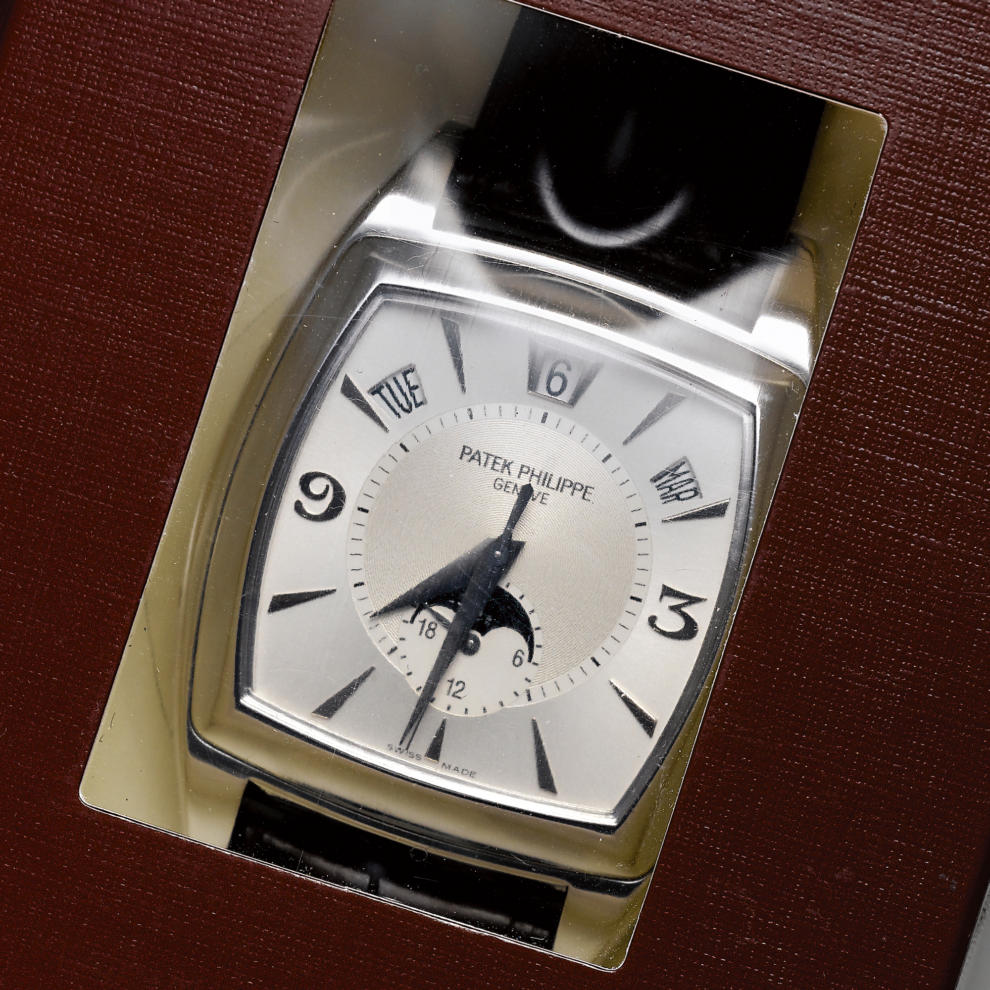 Patek Philippe, A FINE CUSHION FORM WHITE GOLD AUTOMATIC CENTER SECONDS ANNUAL CALENDAR WRISTWATCH WITH MOON-PHASES AND 24 HOURS INDICATION CIRCA 2005 REF. 5135G-001 GONDOLO CALENDARIO MVT 3422606 CASE 4290203