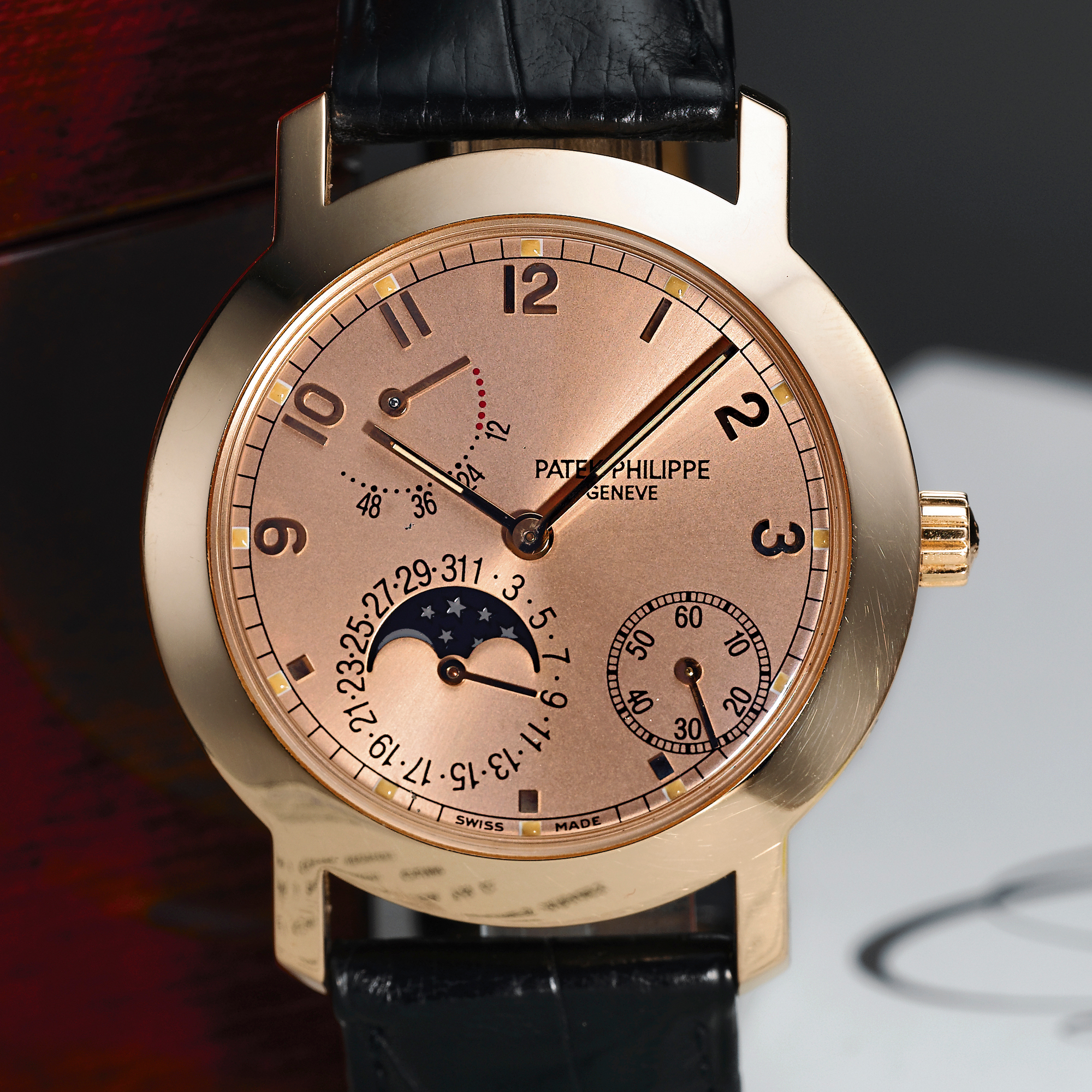 Patek Philippe, A PINK GOLD AUTOMATIC WRISTWATCH WITH DATE, MOON-PHASES AND POWER RESERVE INDICATIONCIRCA 2000 REF 5055 MVT 3166449 CASE 4067601