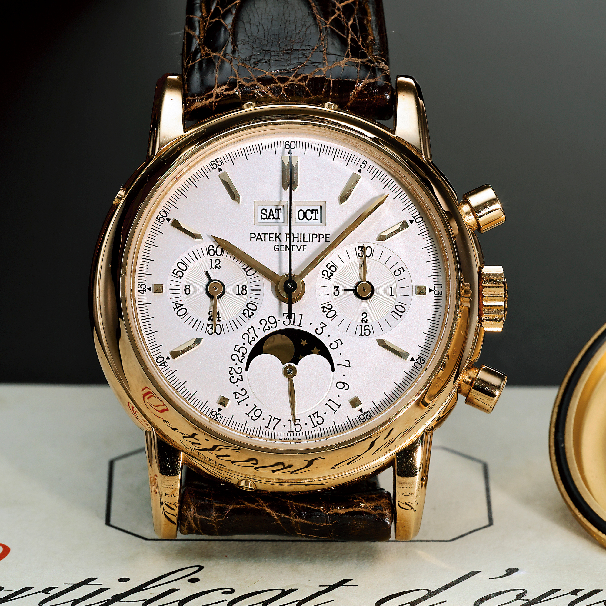Patek Philippe, A FINE AND RARE GOLD PERPETUAL CALENDAR CHRONOGRAPH WRISTWATCH WITH REGISTER AND MOON-PHASES, 24-HOUR AND LEAP YEAR INDICATON CIRCA 1991 REF.3970EJ MVT 876133 CASE 2900931 