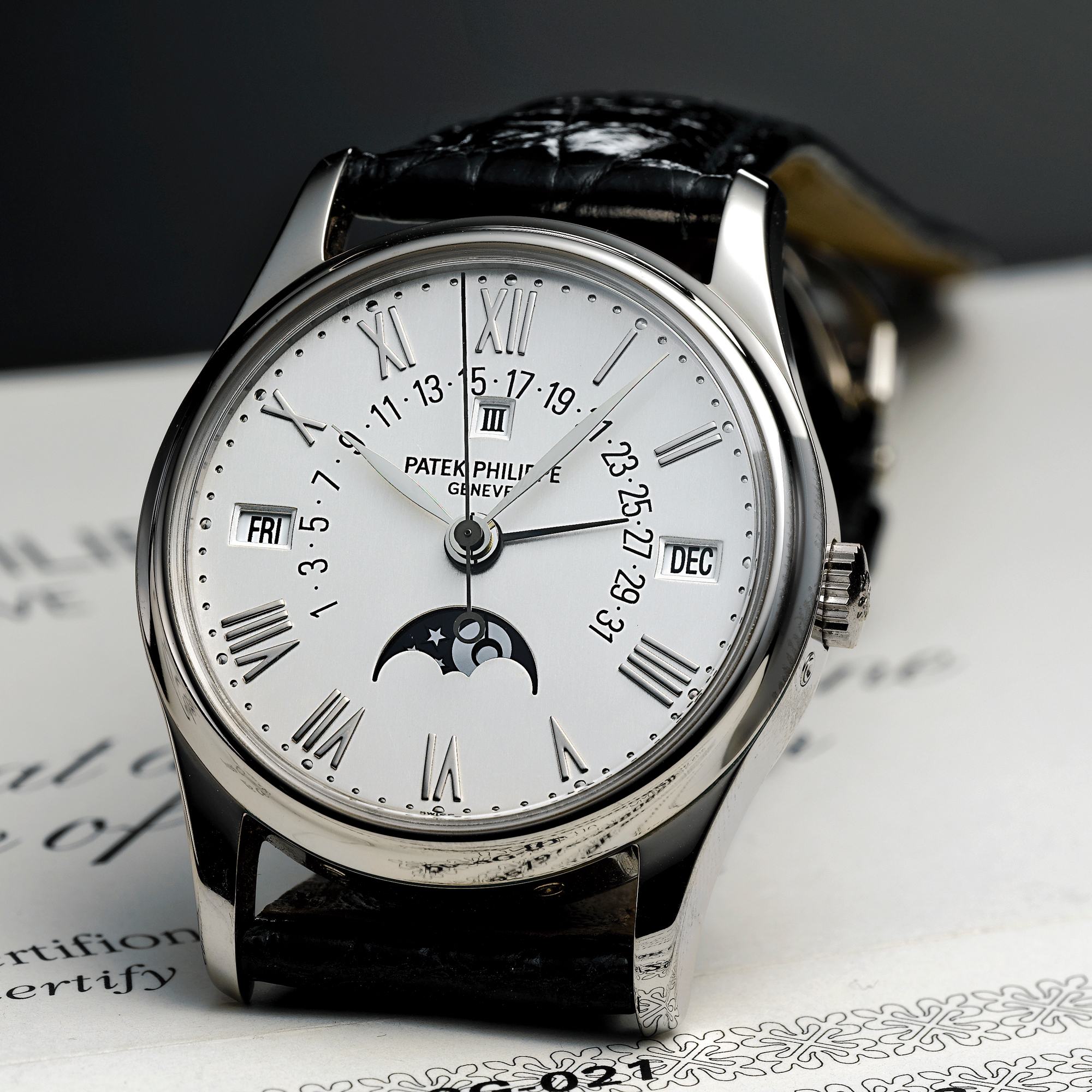 Patek Philippe, A FINE AND RARE WHITE GOLD PERPETUAL CALENDAR AUTOMATIC CENTRE SECONDS WRISTWATCH WITH RETROGRADE DATE CIRCA 2004 REF 5050G MVT 1957976 CASE 2980858