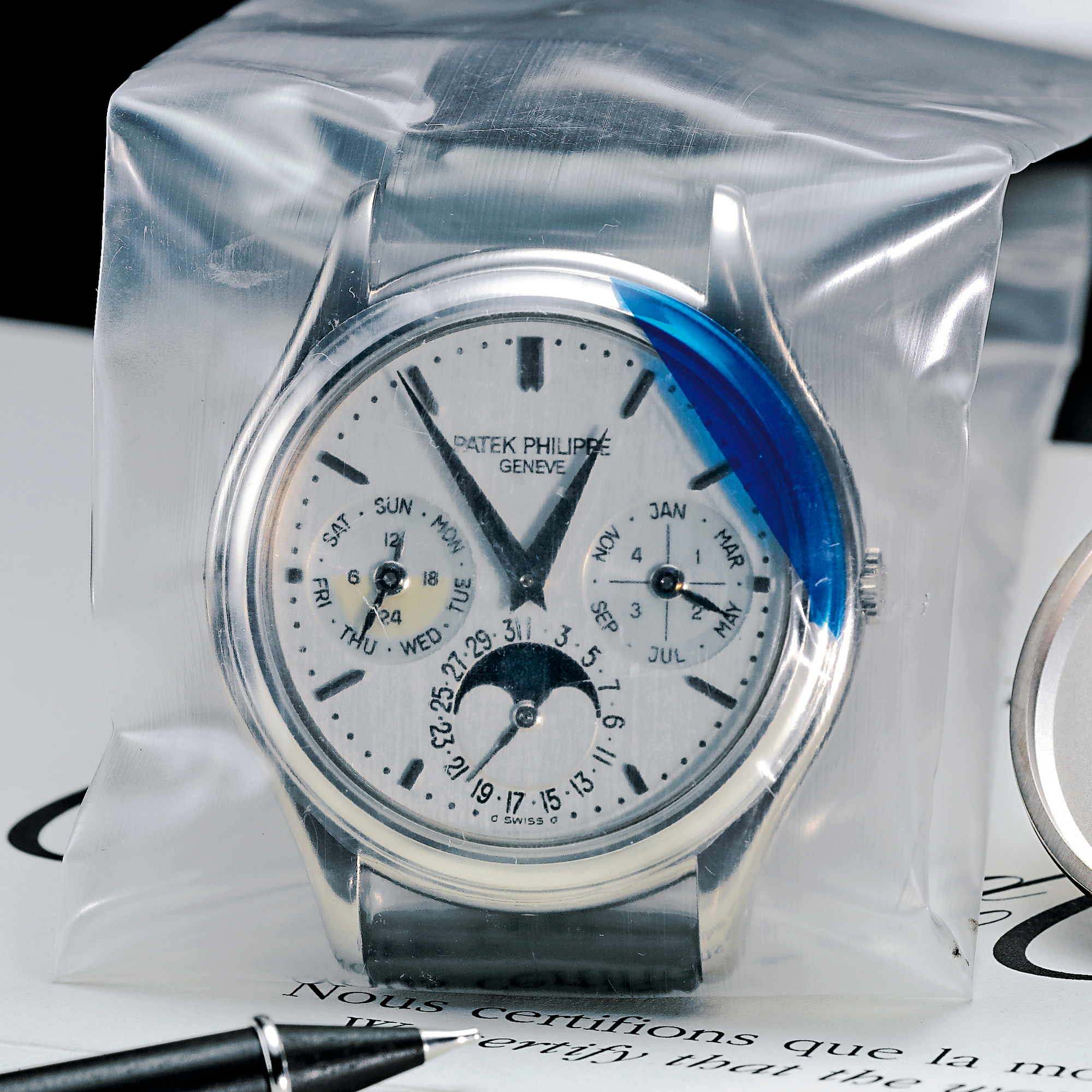 Patek Philippe, A FINE WHITE GOLD AUTOMATIC PERPETUAL CALENDAR WRISTWATCH WITH MOON-PHASES, 24-HOUR AND LEAP YEAR INDICATION CIRCA 2003 REF 3940G MVT 3126312 CASE 4220762