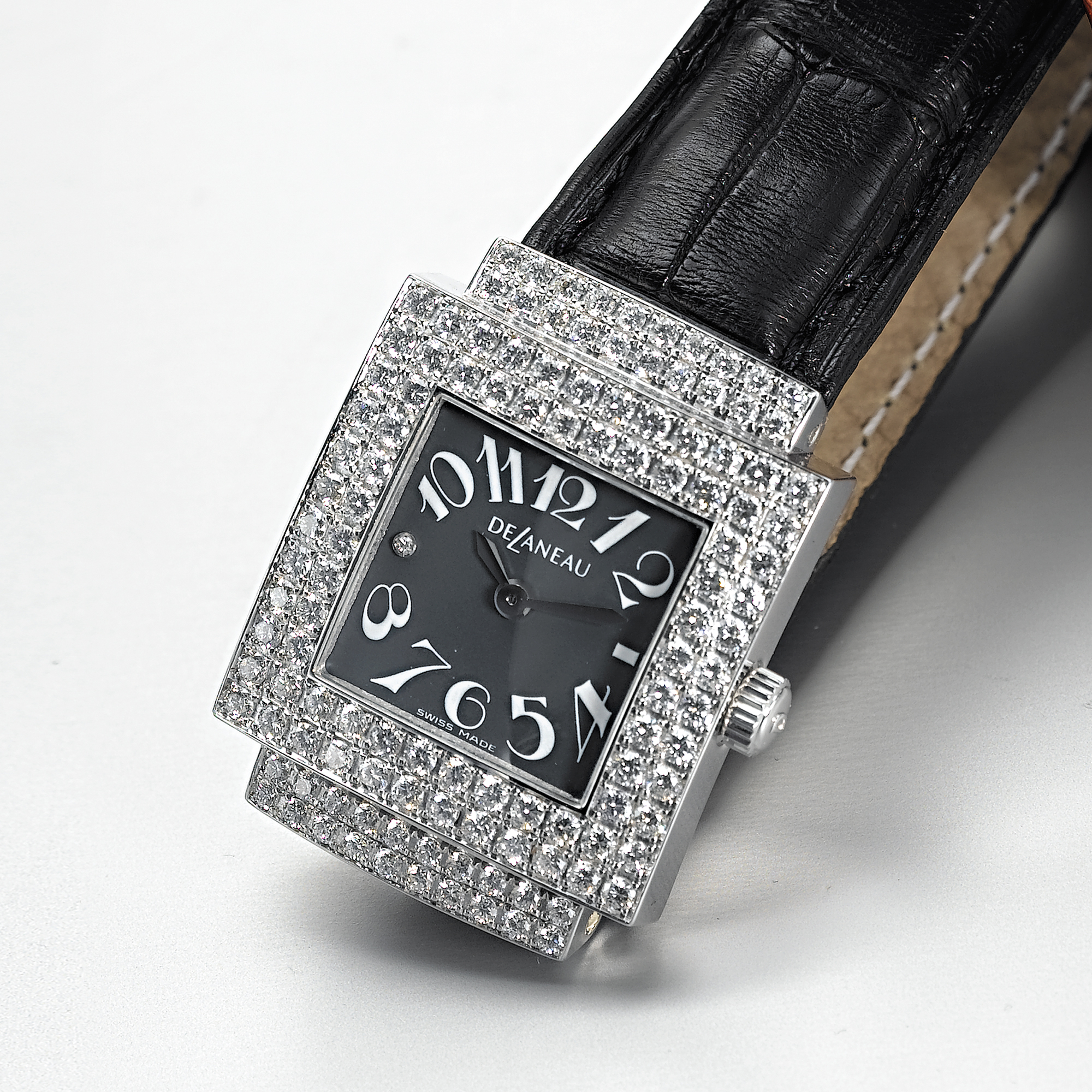 DELANEAU, A LADY'S WHITE GOLD AND DIAMOND SET SQUARE WRISTWATCHBALI, CIRCA 2003
