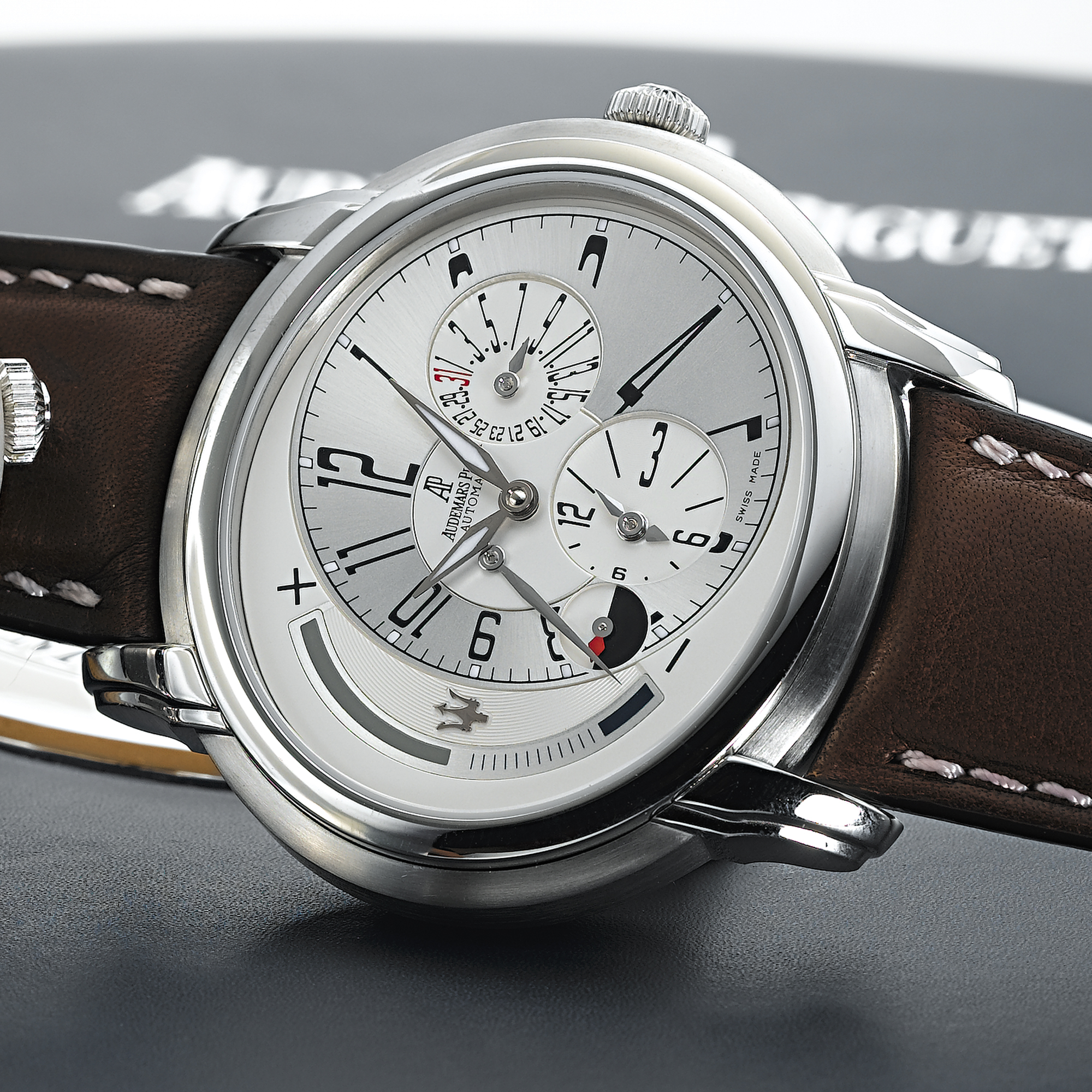 AUDEMARS PIGUET, A FINE STAINLESS STEEL LIMITED EDITION AUTOMATIC DUAL TIME ZONE WRISTWATCH WITH DATE, DAY/NIGHT AND POWER RESERVE INDICATIONSMILLENARY, CIRCA 2005, 583/900