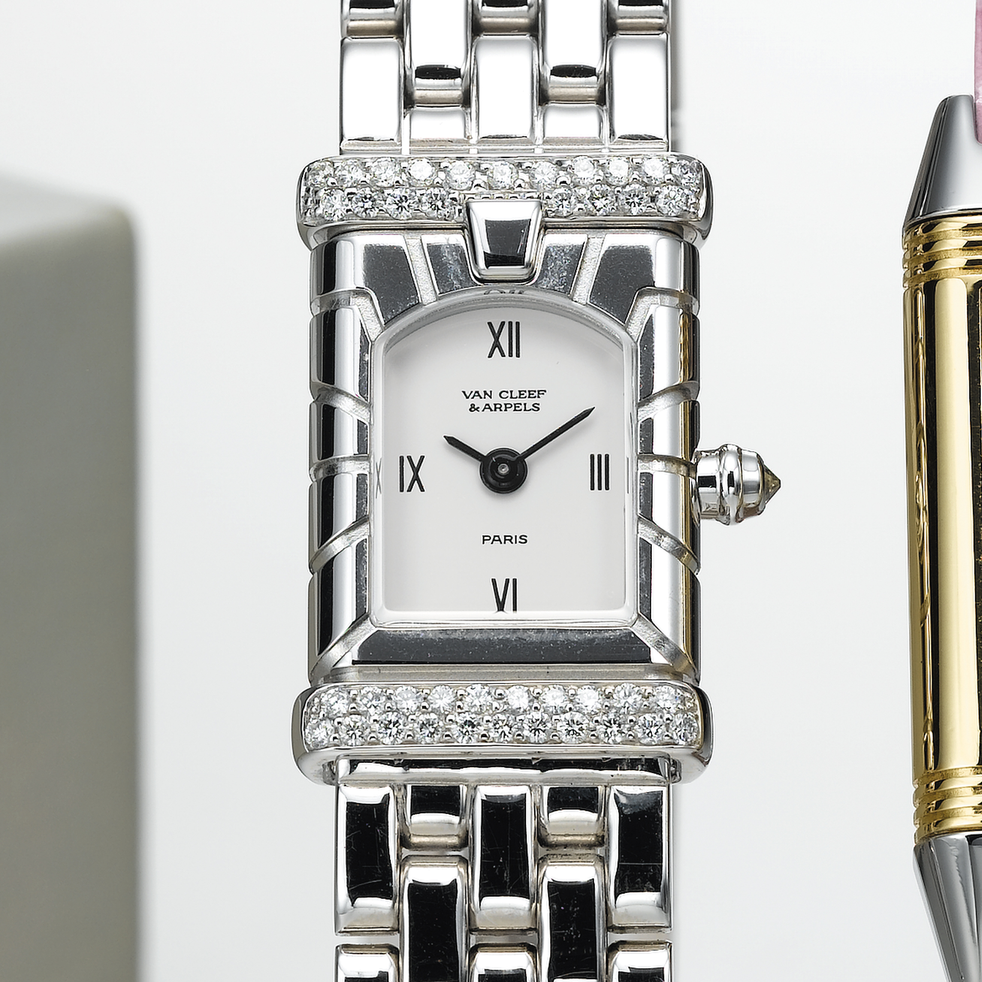 VAN CLEEF & ARPELS, A LADY'S WHITE GOLD AND DIAMOND SET RECTANGULAR WRISTWATCH WITH BRACELETFACADE, CIRCA 1996