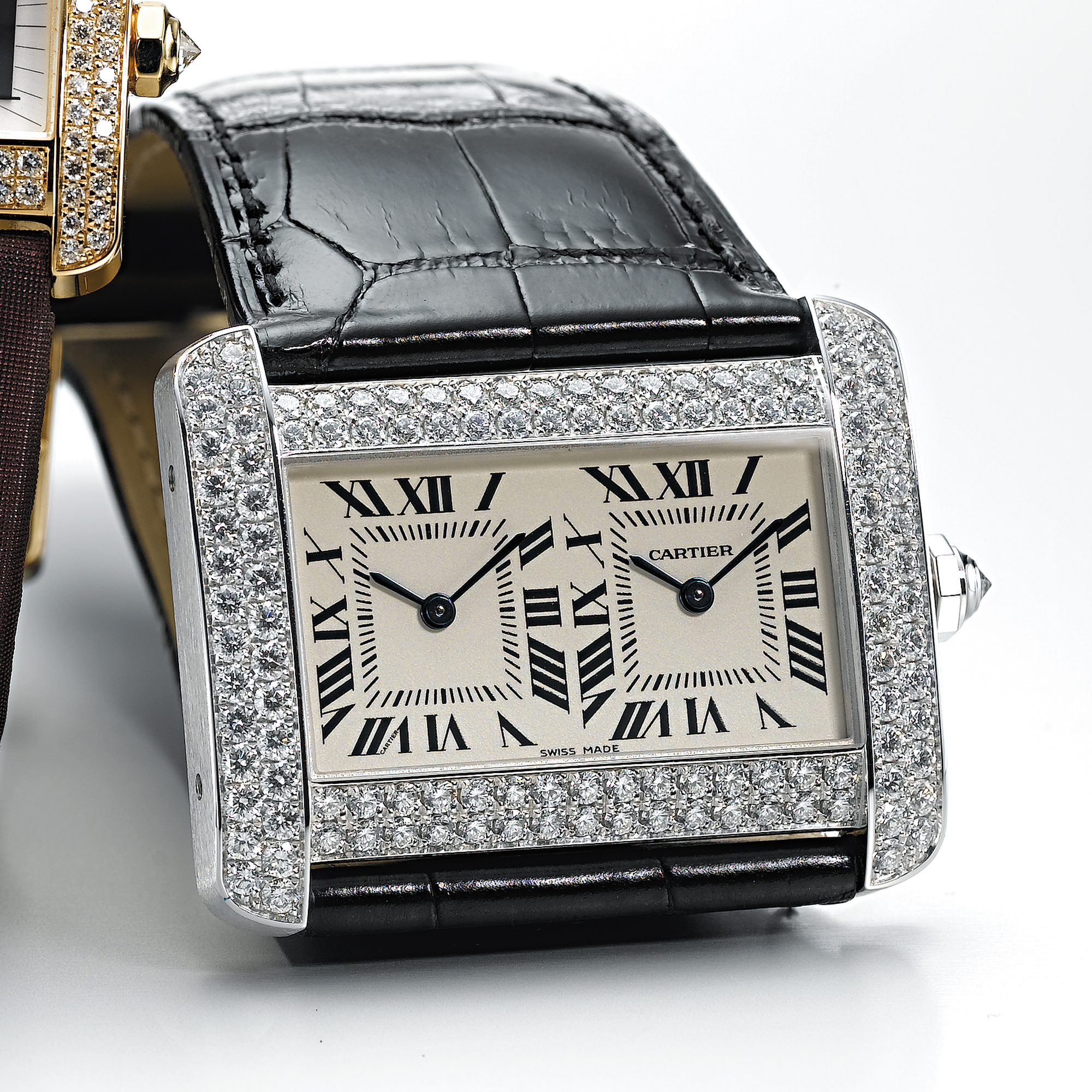 CARTIER, A WHITE GOLD AND DIAMOND SET RECTANGULAR DUAL TIME ZONE WRISTWATCHTANK DIVAN, CIRCA 2005