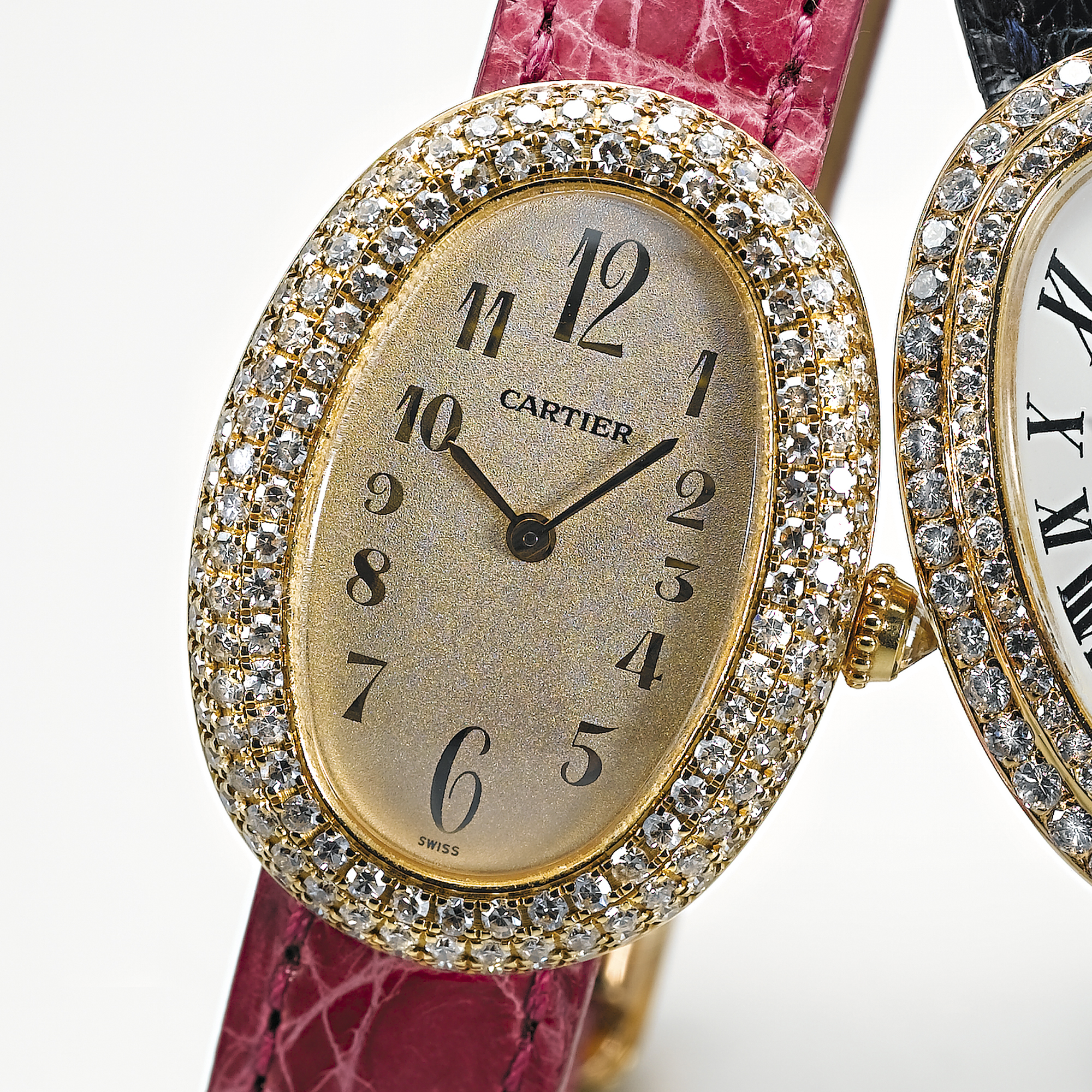 CARTIER, A LADY'S GOLD AND DIAMOND SET OVAL WRISTWATCHBAIGNOIRE, CIRCA 2000