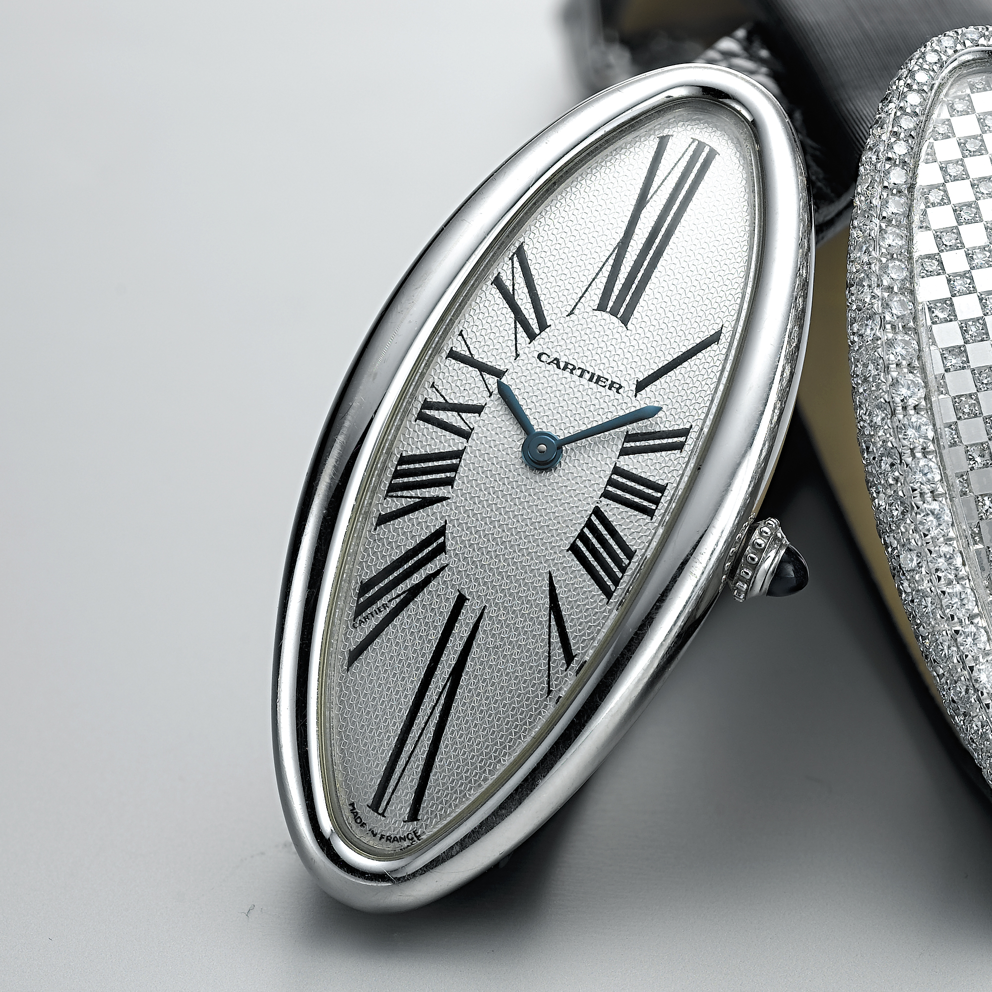 CARTIER, A LADY'S WHITE GOLD ELONGATED OVAL WRISTWATCHBAIGNOIRE ALLONGEE, CIRCA 2005