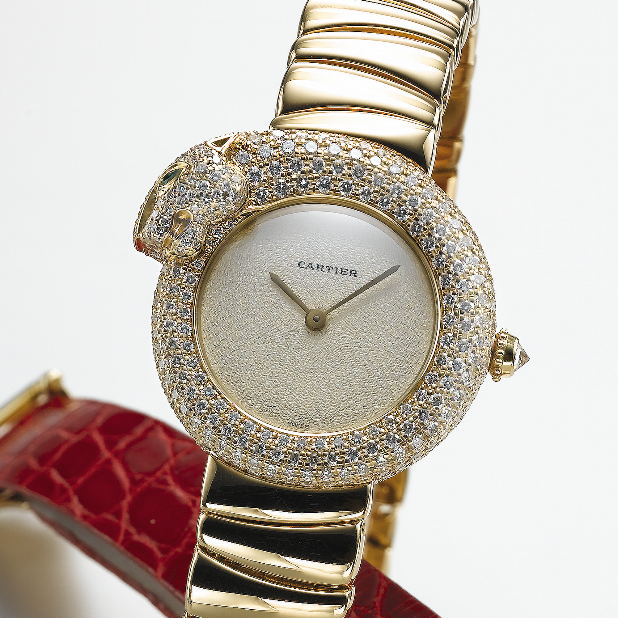 CARTIER, A LADY'S GOLD, DIAMOND AND EMERALD SET BRACELET WATCHPANTHER, CIRCA 2000