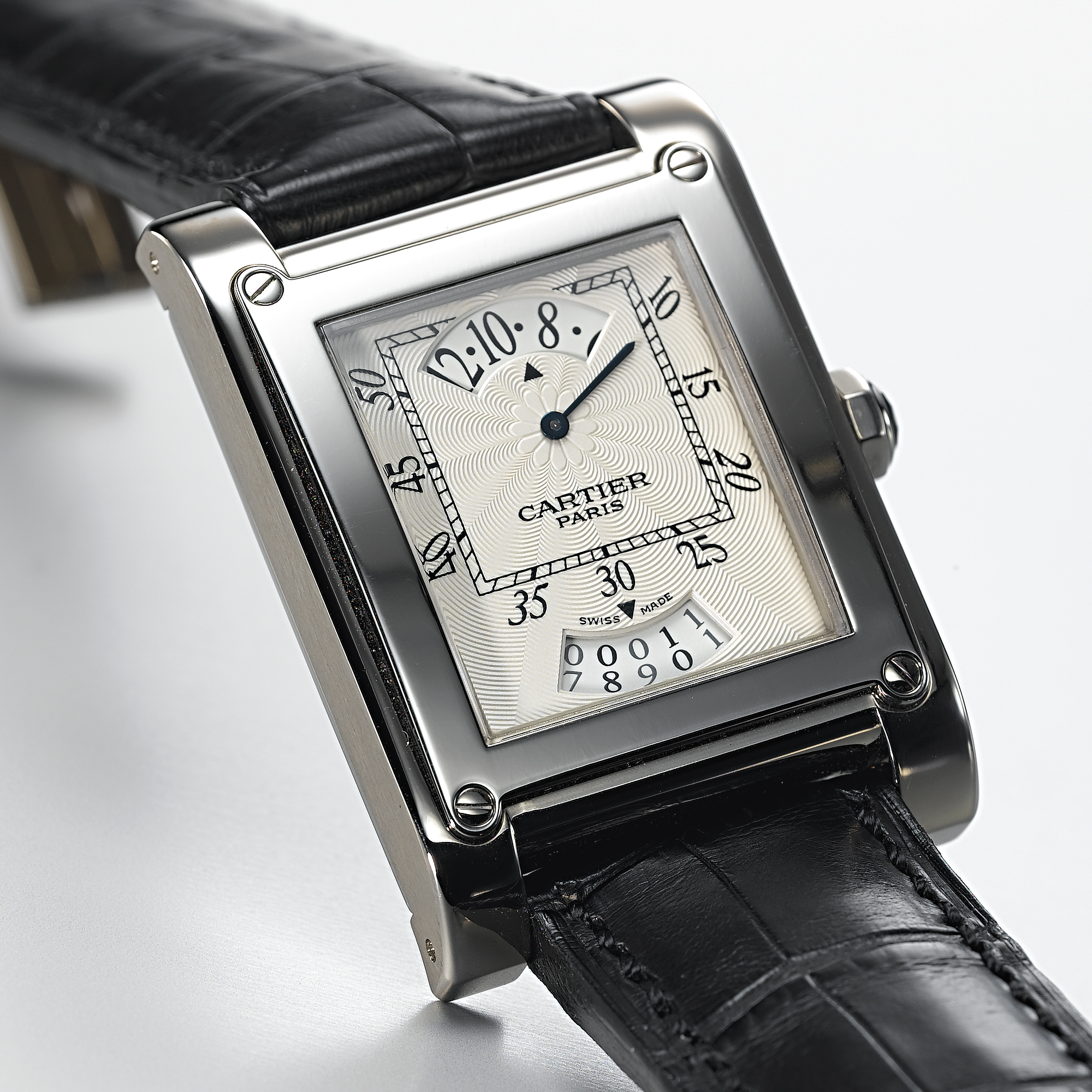 CARTIER, A FINE WHITE GOLD RECTANGULAR WRISTWATCH WITH WANDERING HOUR AND DATETANK A VIS, CIRCA 2004, NO. 220, REF. 2554