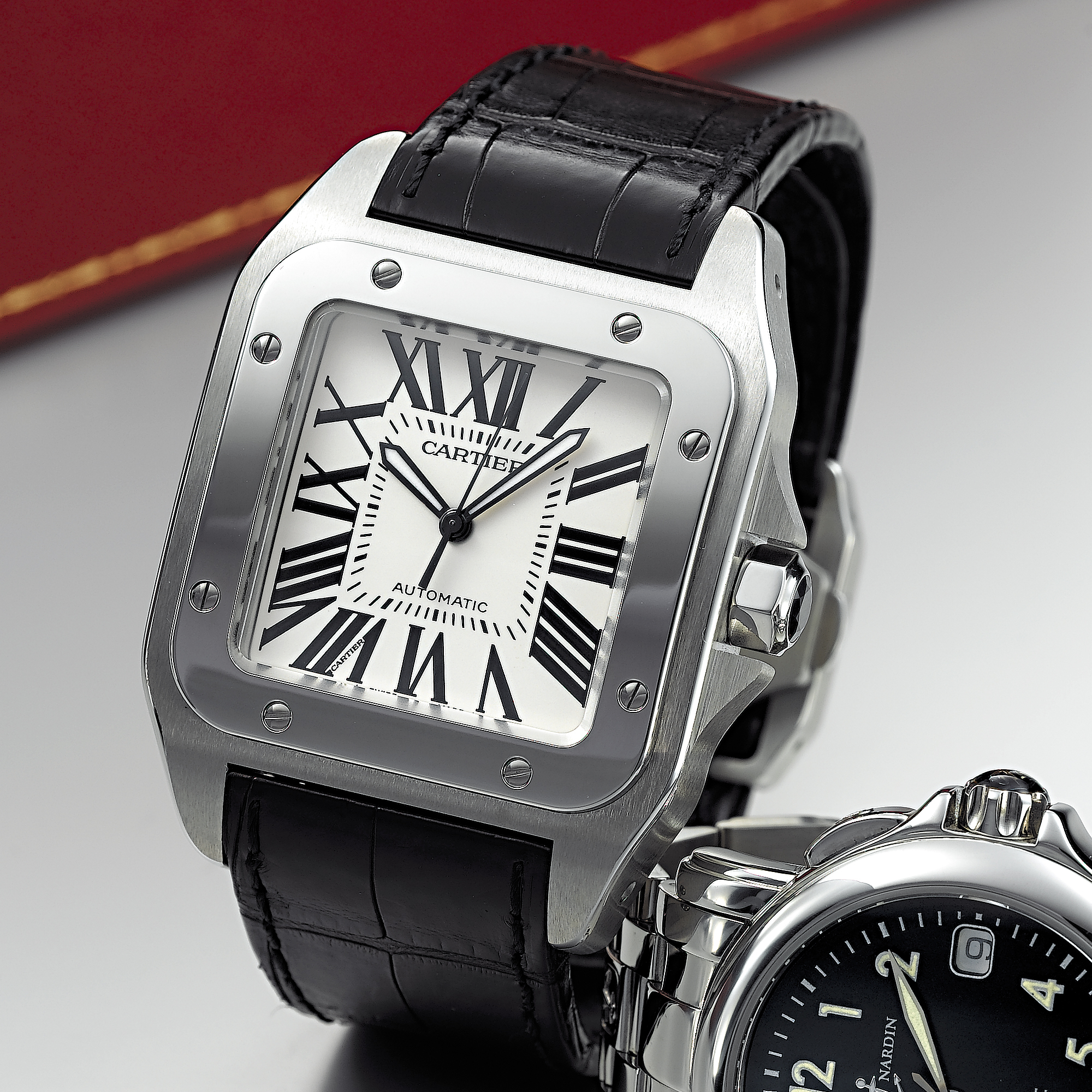 CARTIER, AN OVERSIZED STAINLESS STEEL AUTOMATIC CENTRE SECONDS SQUARE WRISTWATCHSANTOS 100, CIRCA 2004