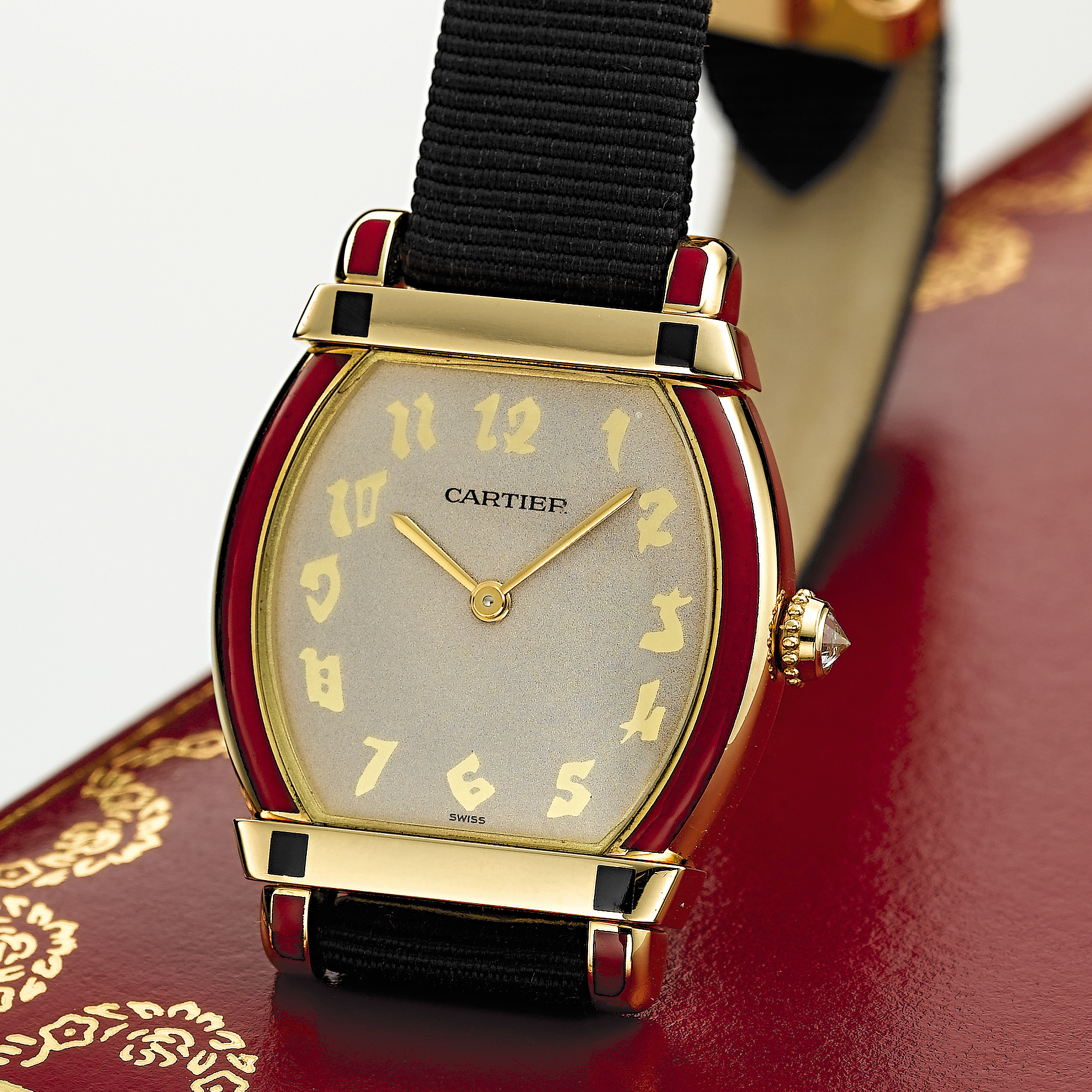 CARTIER, A LADY'S GOLD AND ENAMEL TONNEAU FORM WRISTWATCHTORTUE, CIRCA 2003