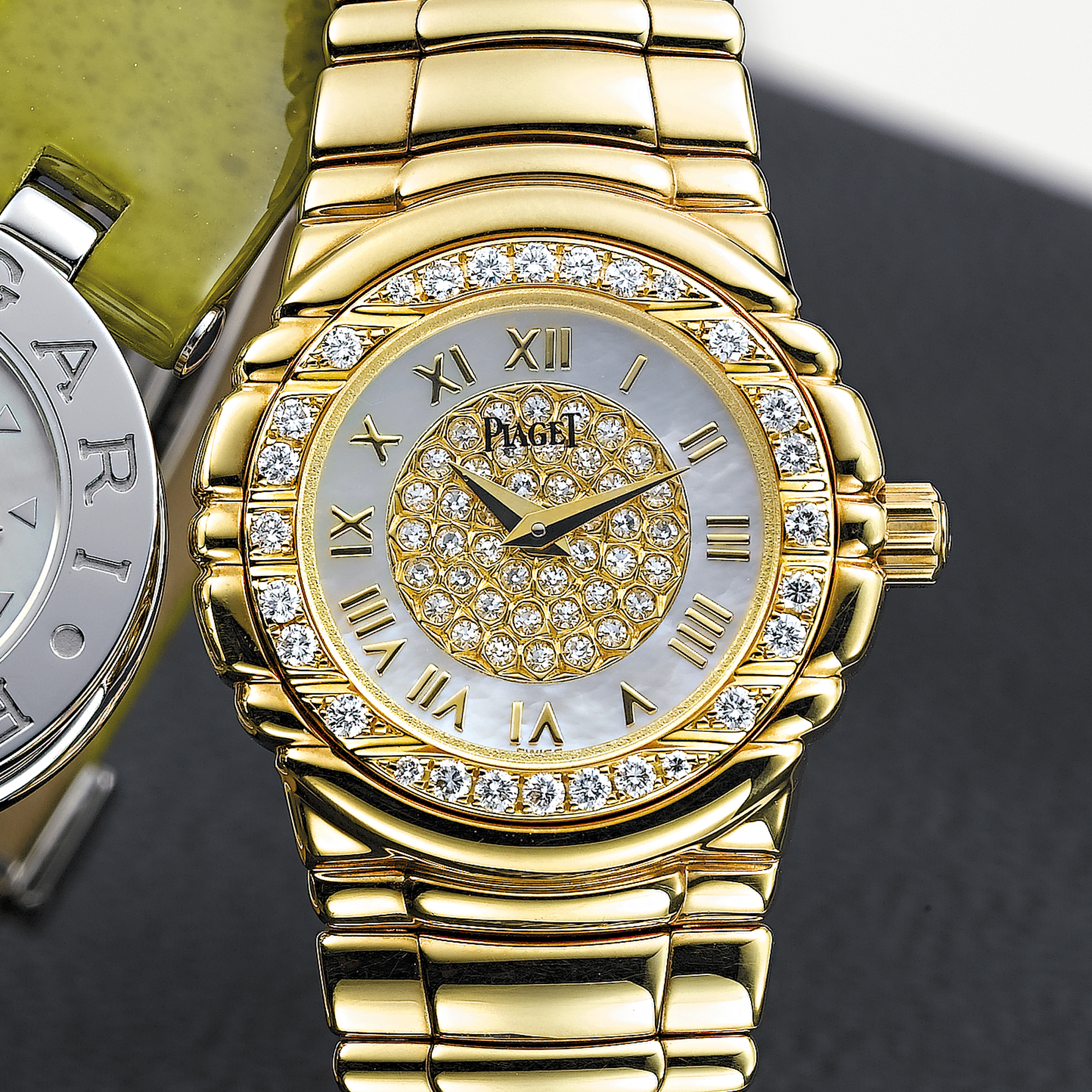 PIAGET, A LADY'S GOLD AND DIAMOND SET BRACELET WATCH WITH MOTHER-OF-PEARL DIALTANAGRA, CIRCA 2003