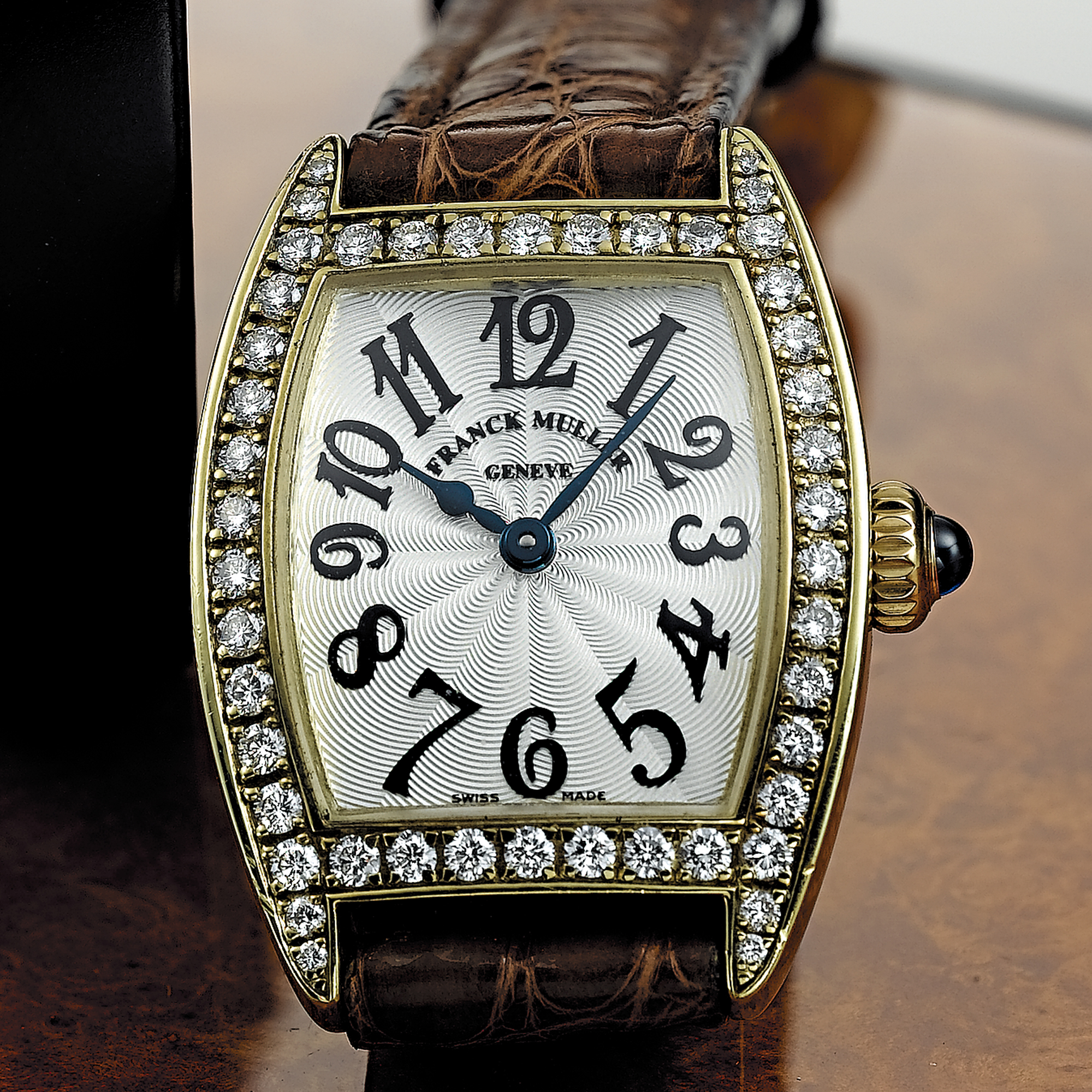 FRANCK MULLER, A LADY'S GOLD AND DIAMOND SET TONNEAU FORM WRISTWATCHCIRCA 2000, 2500QZ DP, NO. 48