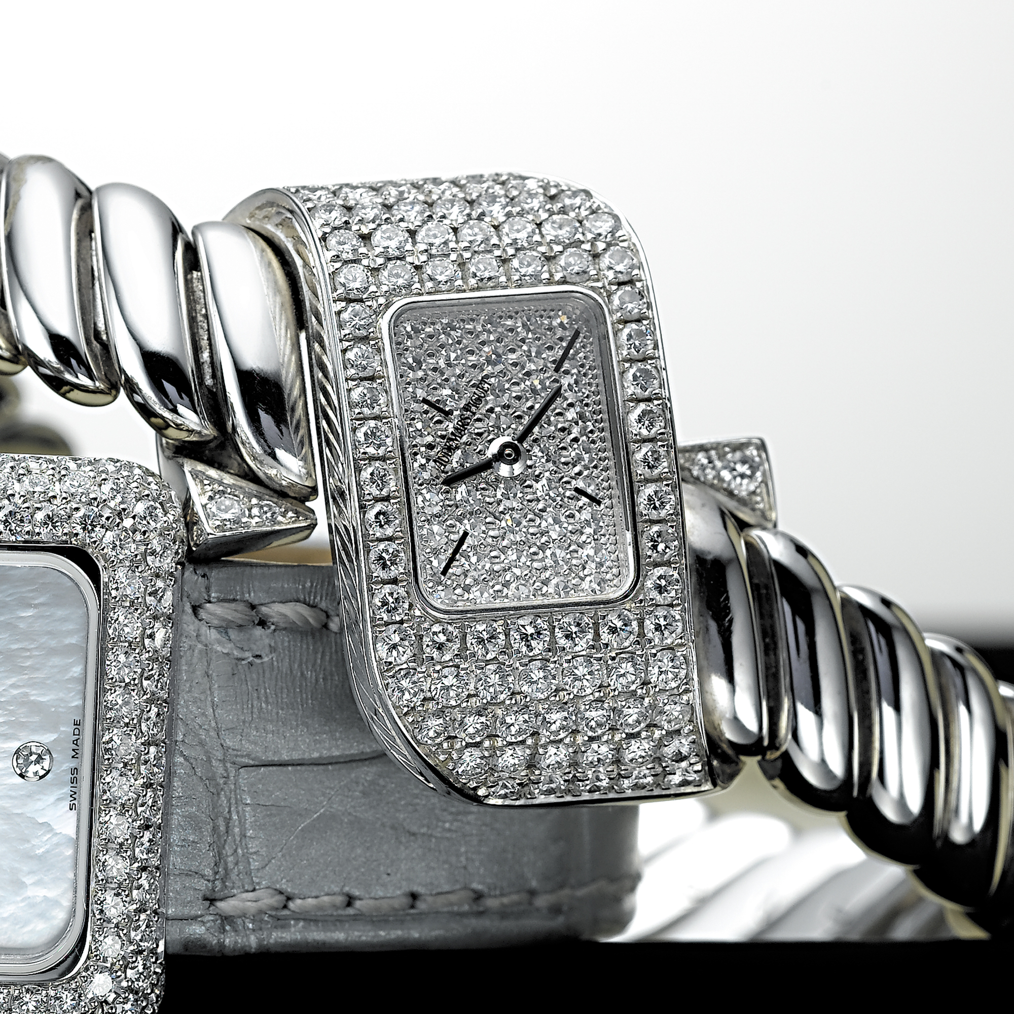 AUDEMARS PIGUET, A LADY'S WHITE GOLD AND DIAMOND SET FANCY-SHAPED BRACELET WATCHCIRCA 2003
