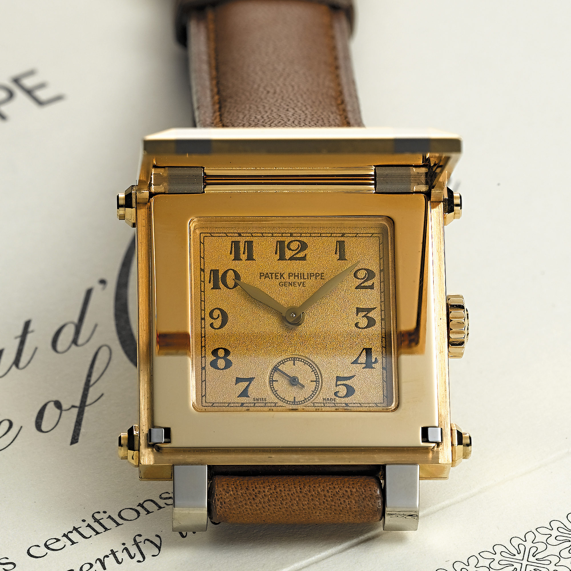 PATEK PHILIPPE, A TWO-COLOUR GOLD SQUARE WRISTWATCH WITH HINGED COVERCABRIOLET GONDOLO, CIRCA 2000, NO. 1.875.581, REF. 5099 