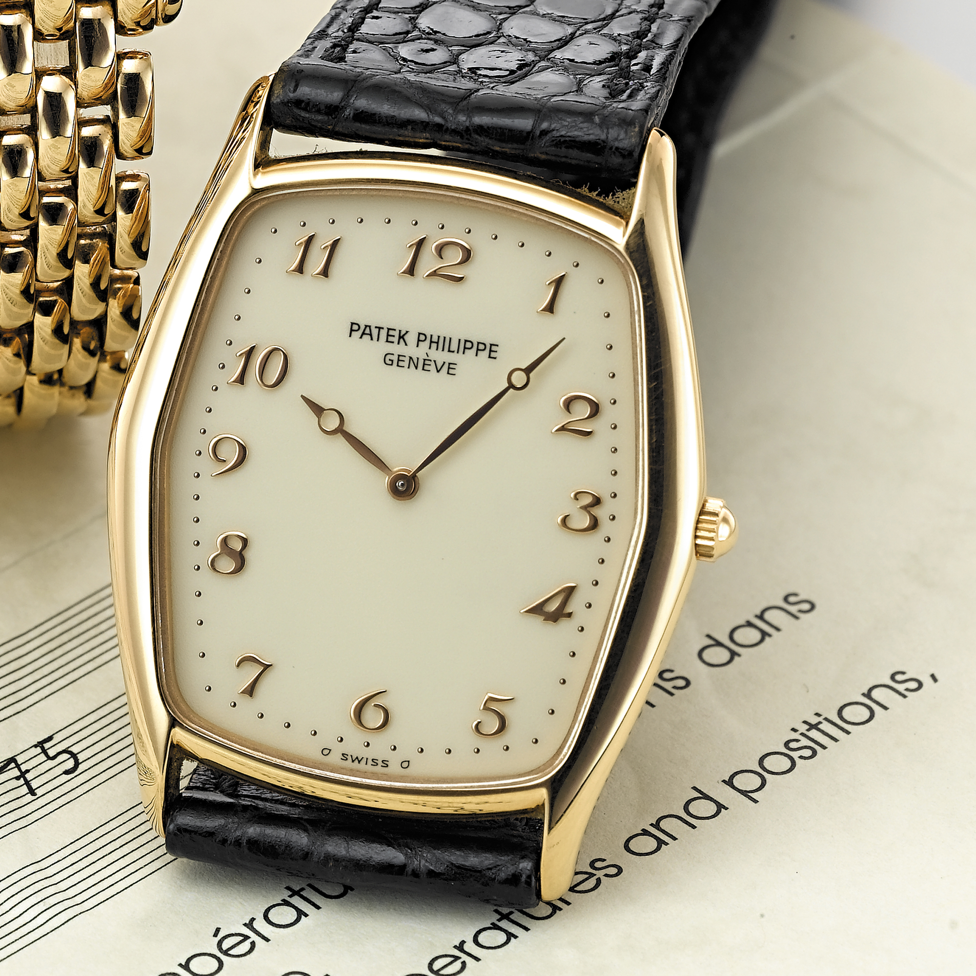 PATEK PHILIPPE, A PINK GOLD TONNEAU WRISTWATCHCIRCA 1995, NO. 1.374.775, REF. 3842