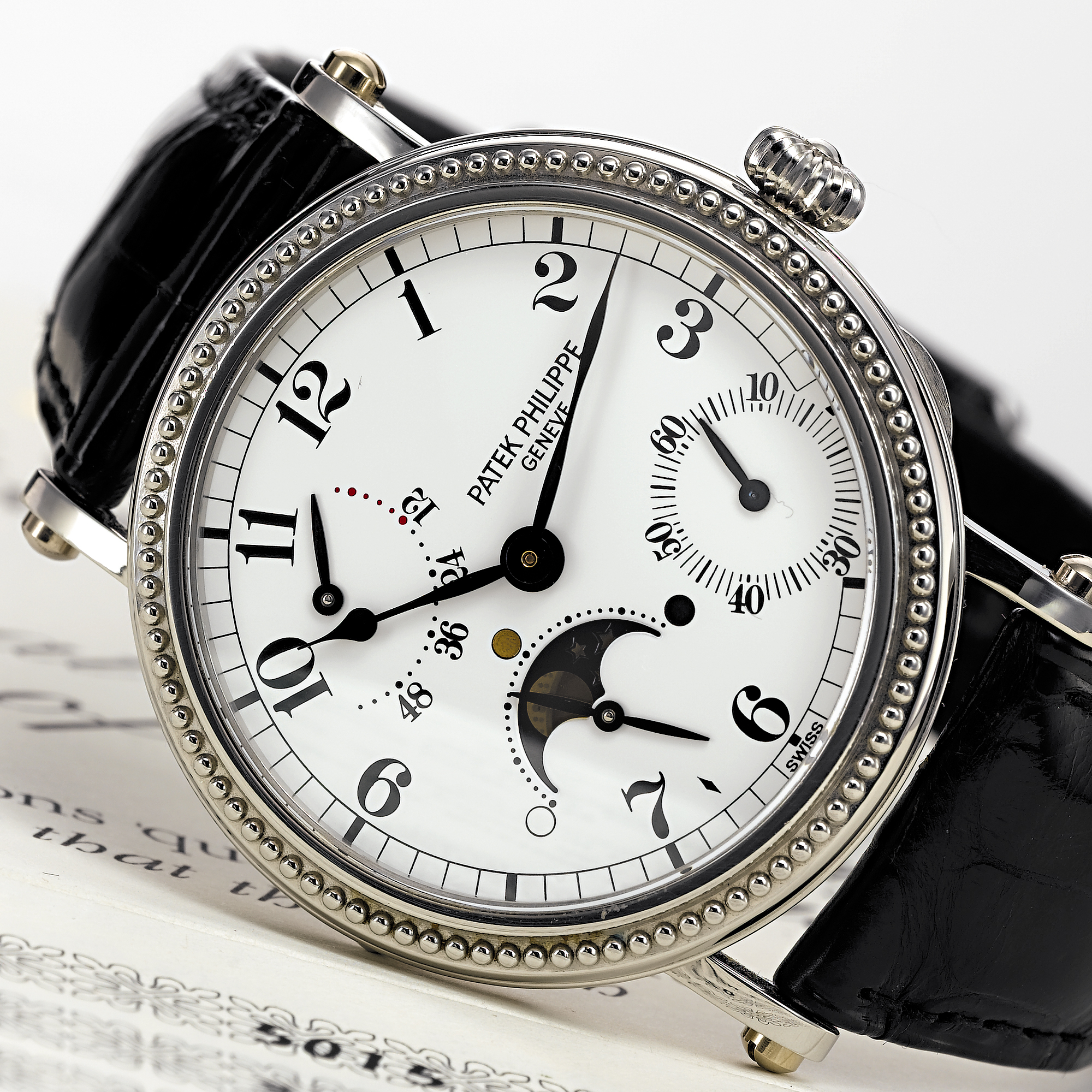 PATEK PHILIPPE, A FINE PLATINUM AUTOMATIC WRISTWATCH WITH MOON PHASES AND POWER RESERVE INDICATIONCIRCA 1997, NO. 3.050.620, REF. 5015