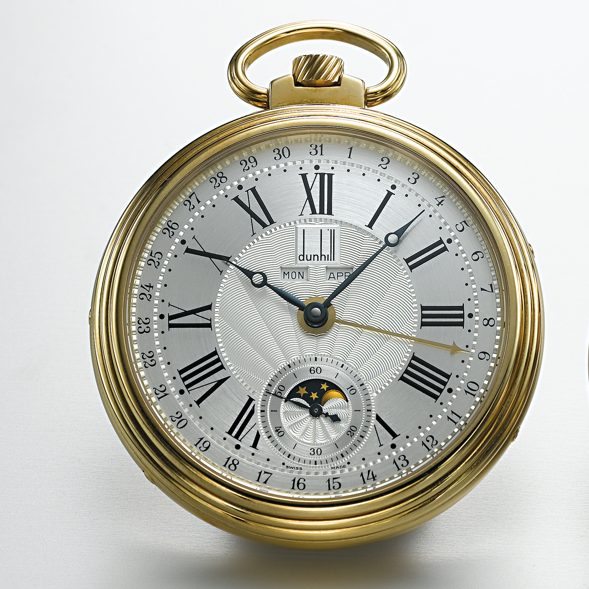 DUNHILL, A GOLD TRIPLE CALENDAR OPEN-FACED WATCH WITH MOON PHASESCIRCA 1995