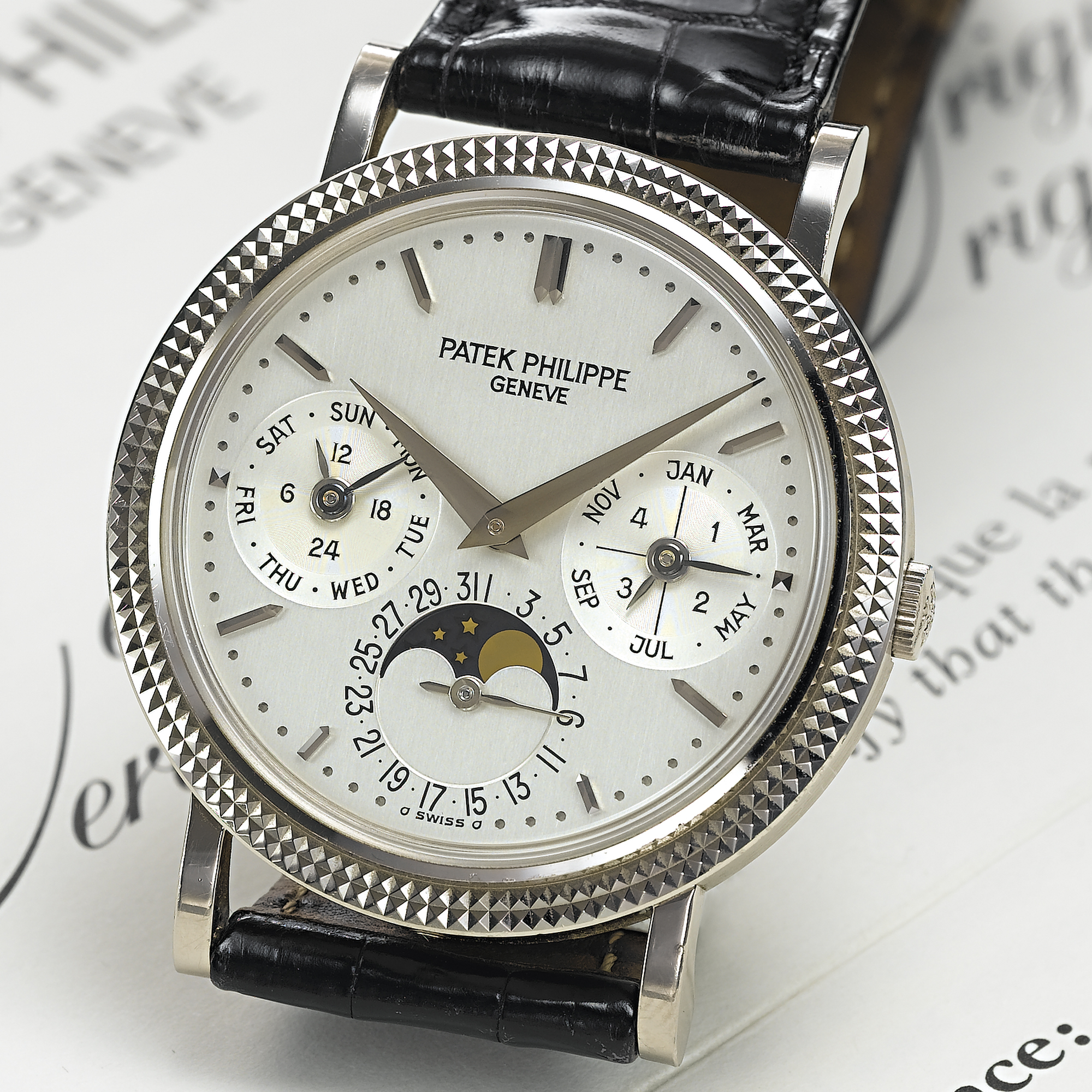 PATEK PHILIPPE, A FINE WHITE GOLD AUTOMATIC PERPETUAL CALENDAR WRISTWATCH WITH MOON PHASES AND 24 HOUR INDICATIONCIRCA 1998, NO. 776.394, REF. 5039