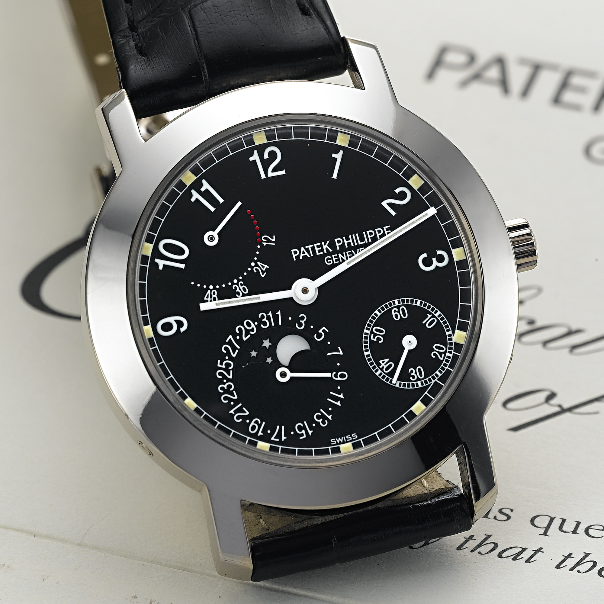 PATEK PHILIPPE, A FINE WHITE GOLD AUTOMATIC WRISTWATCH WITH DATE, MOON PHASES AND POWER RESERVE INDICATIONCIRCA 1998, NO. 3.109.592, REF. 5055 