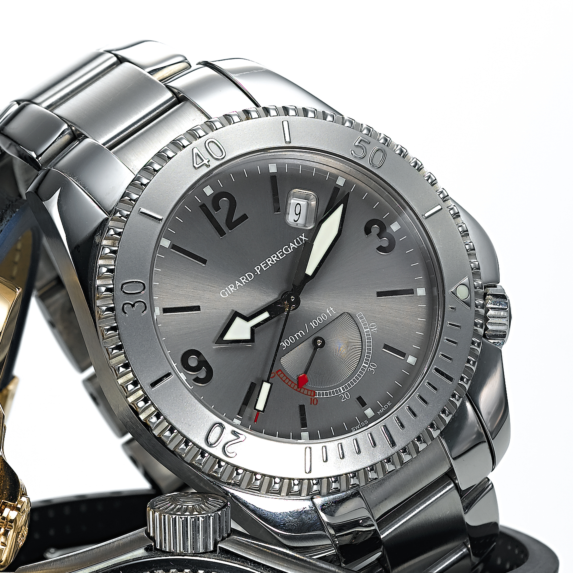 GIRARD-PERREGAUX, A STAINLESS STEEL AUTOMATIC CENTRE SECONDS WRISTWATCH WITH DATE, POWER RESERVE INDICATION AND BRACELETSEA HAWK II, CIRCA 2003, REF. 4990