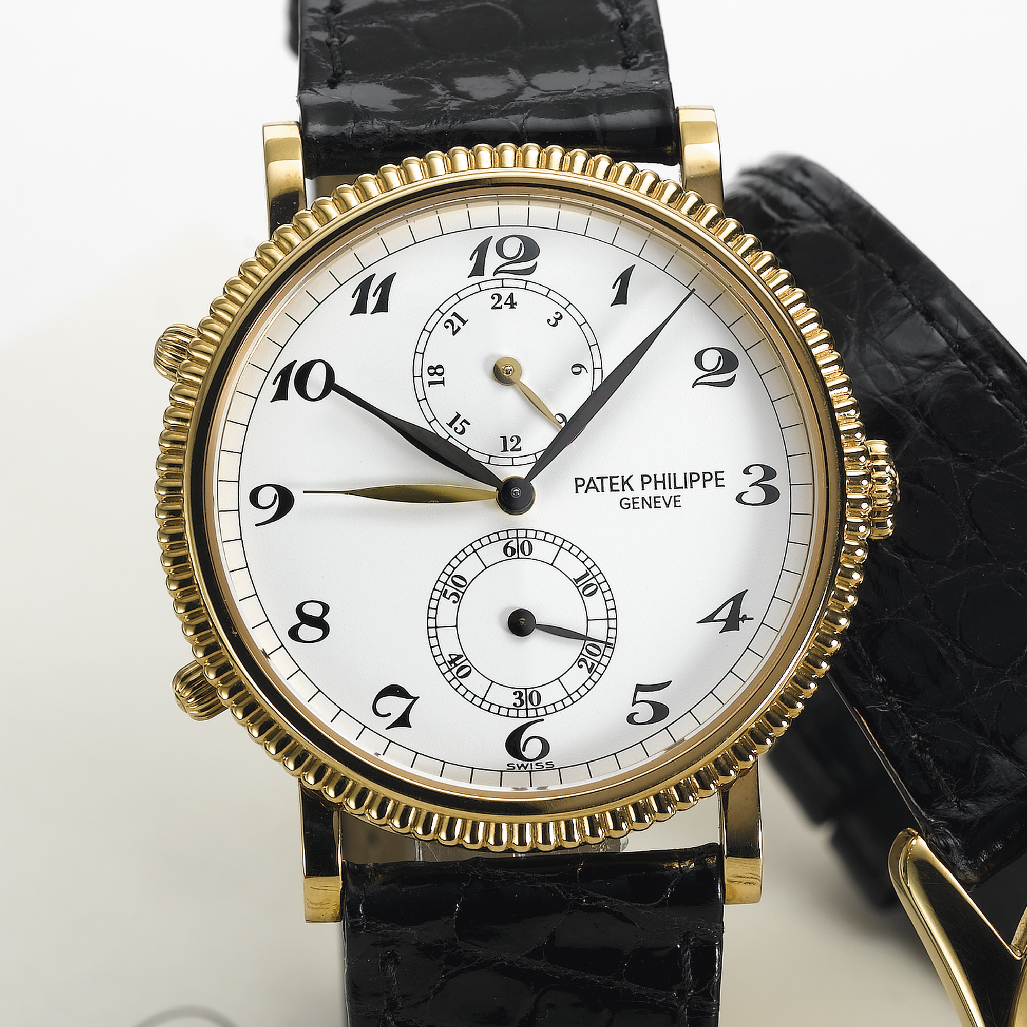 PATEK PHILIPPE, A FINE GOLD DUAL TIME ZONE WRISTWATCH WITH 24-HOUR INDICATIONTRAVEL TIME, CIRCA 2000, NO. 3.079.588, REF. 5034