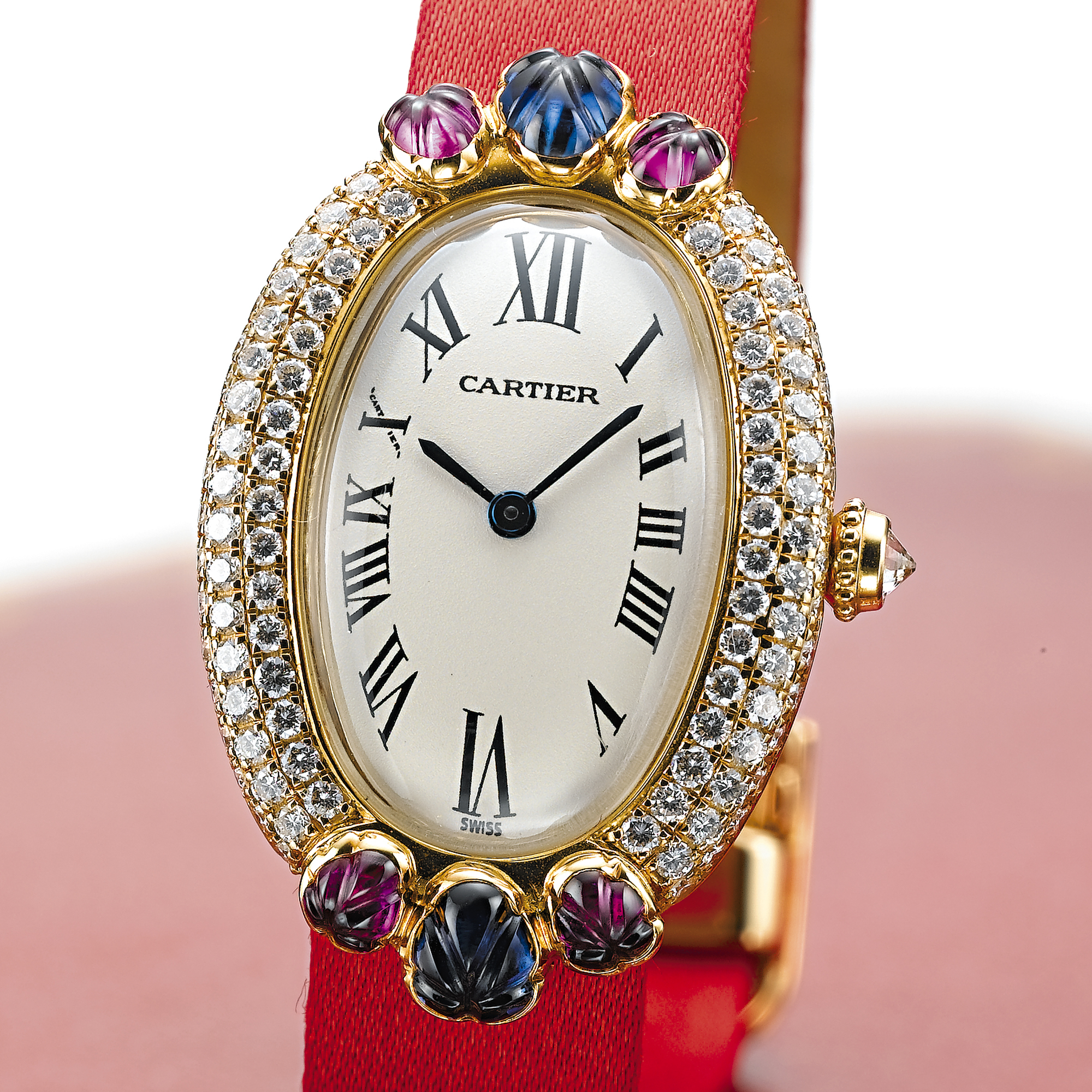 CARTIER, A LADY'S GOLD, DIAMOND, RUBY AND SAPPHIRE SET OVAL WRISTWATCHBAIGNOIRE, CIRCA 1995