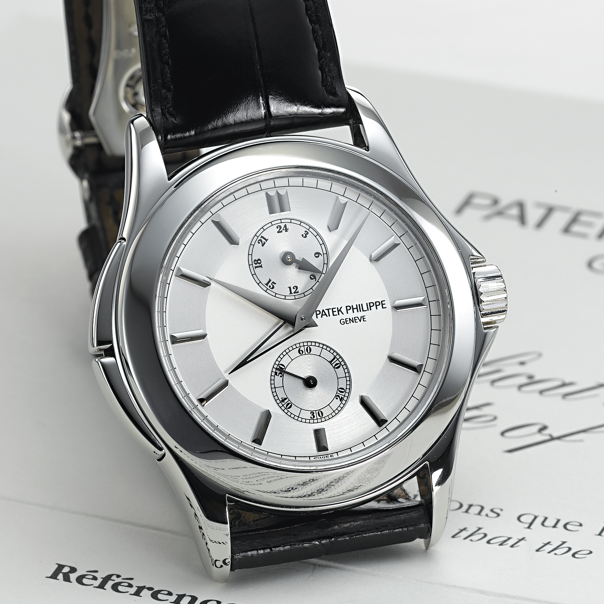 PATEK PHILIPPE, A FINE PLATINUM DUAL TIME WRISTWATCH WITH 24 HOUR INDICATIONCIRCA 2004, NO. 3086926, REF. 5134
