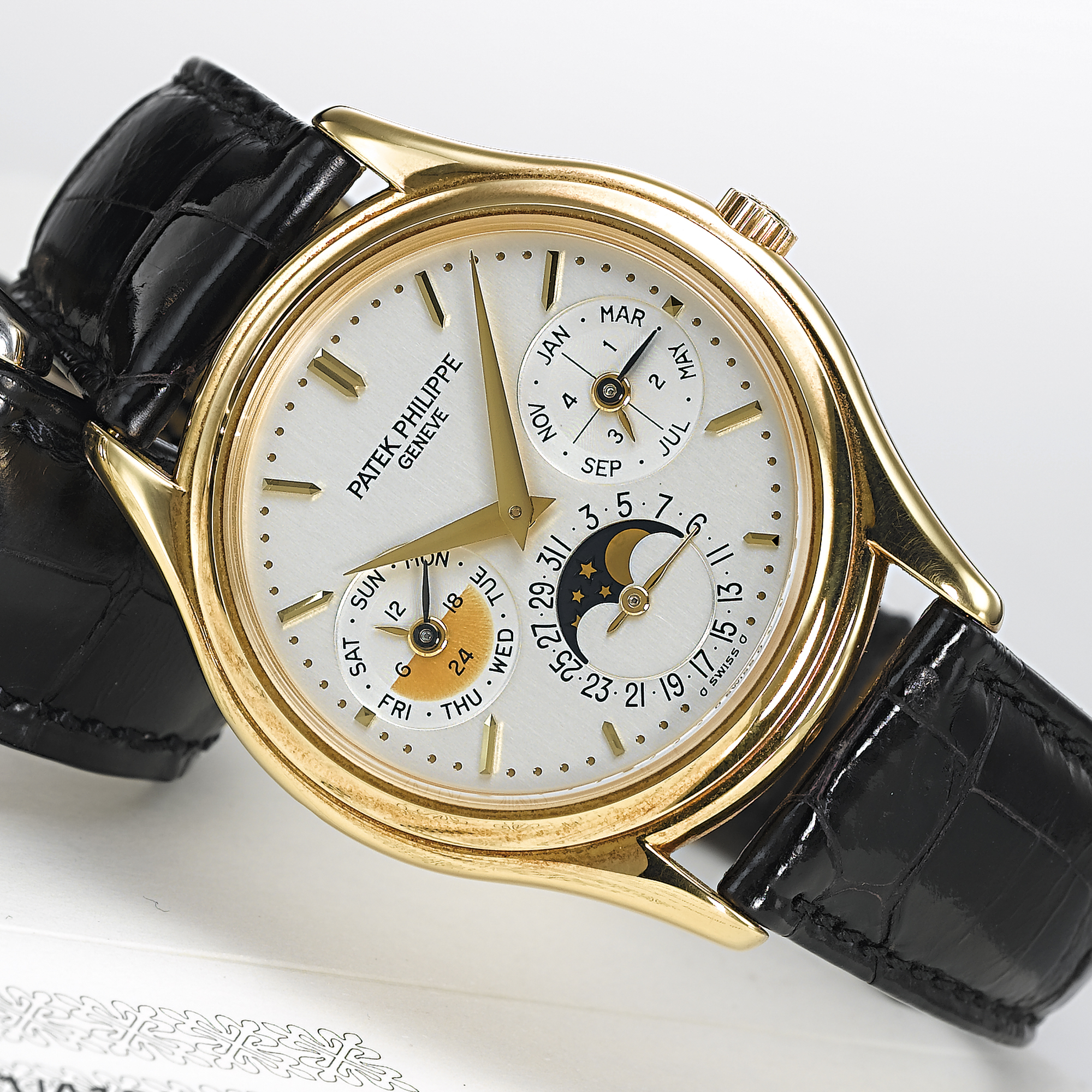 PATEK PHILIPPE, A FINE GOLD AUTOMATIC PERPETUAL CALENDAR WRISTWATCH WITH MOON PHASESCIRCA 2002, NO. 3.125.121, REF. 3940