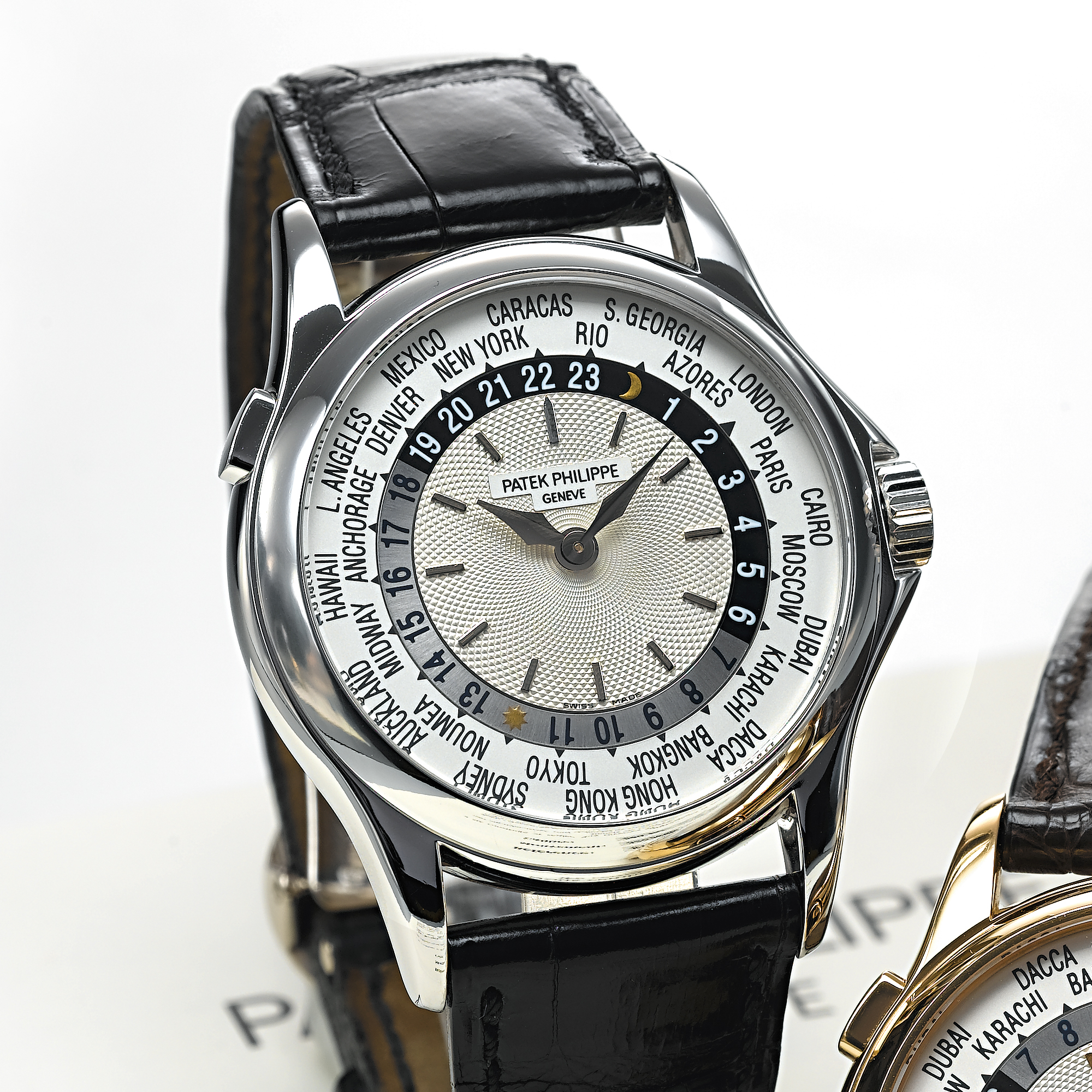 PATEK PHILIPPE, A FINE WHITE GOLD AUTOMATIC WORLD TIME WRISTWATCHCIRCA 2000, NO. 3.206.928, REF. 5110