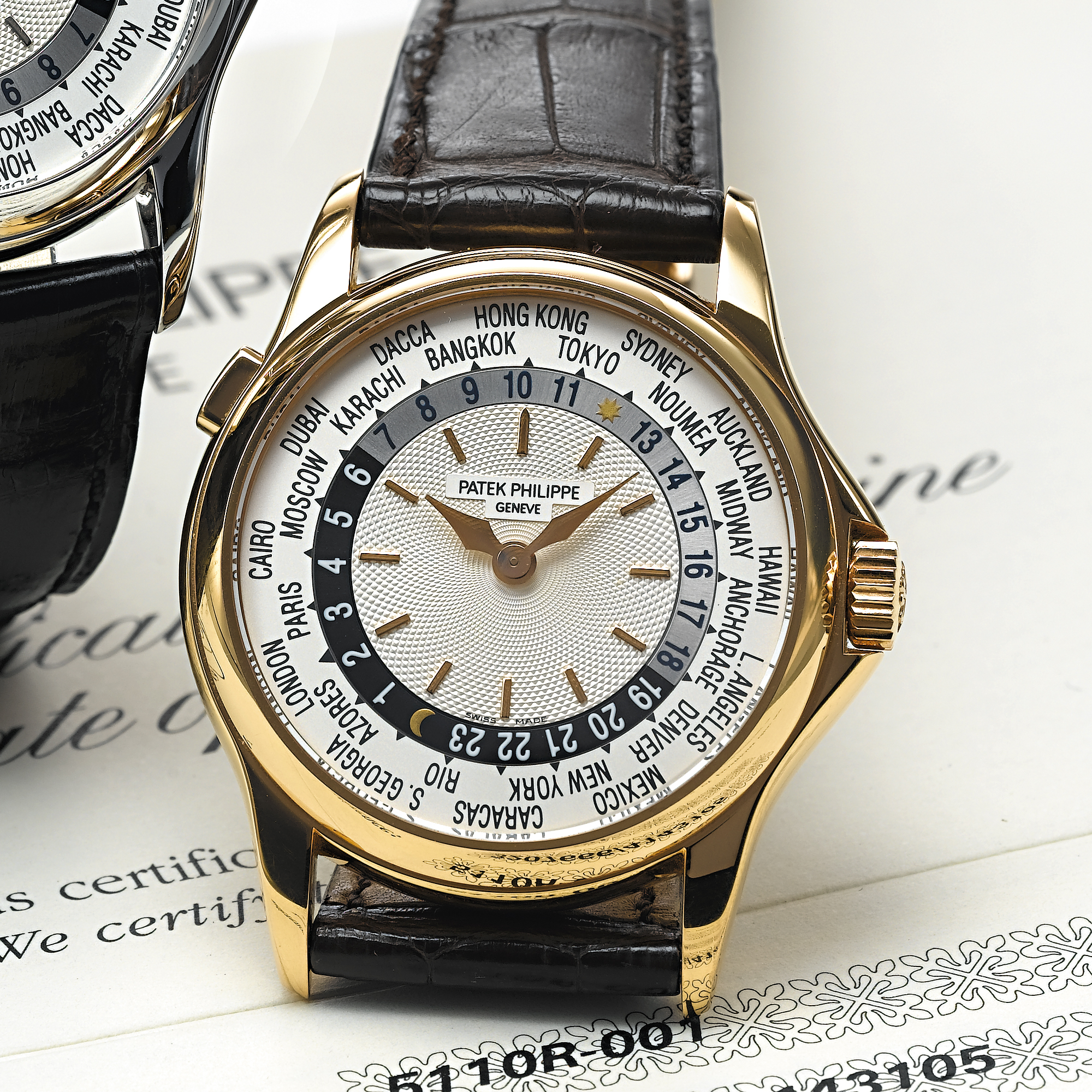 PATEK PHILIPPE, A FINE PINK GOLD AUTOMATIC WORLD TIME WRISTWATCHCIRCA 2001, NO. 3.207.666, REF. 5110
