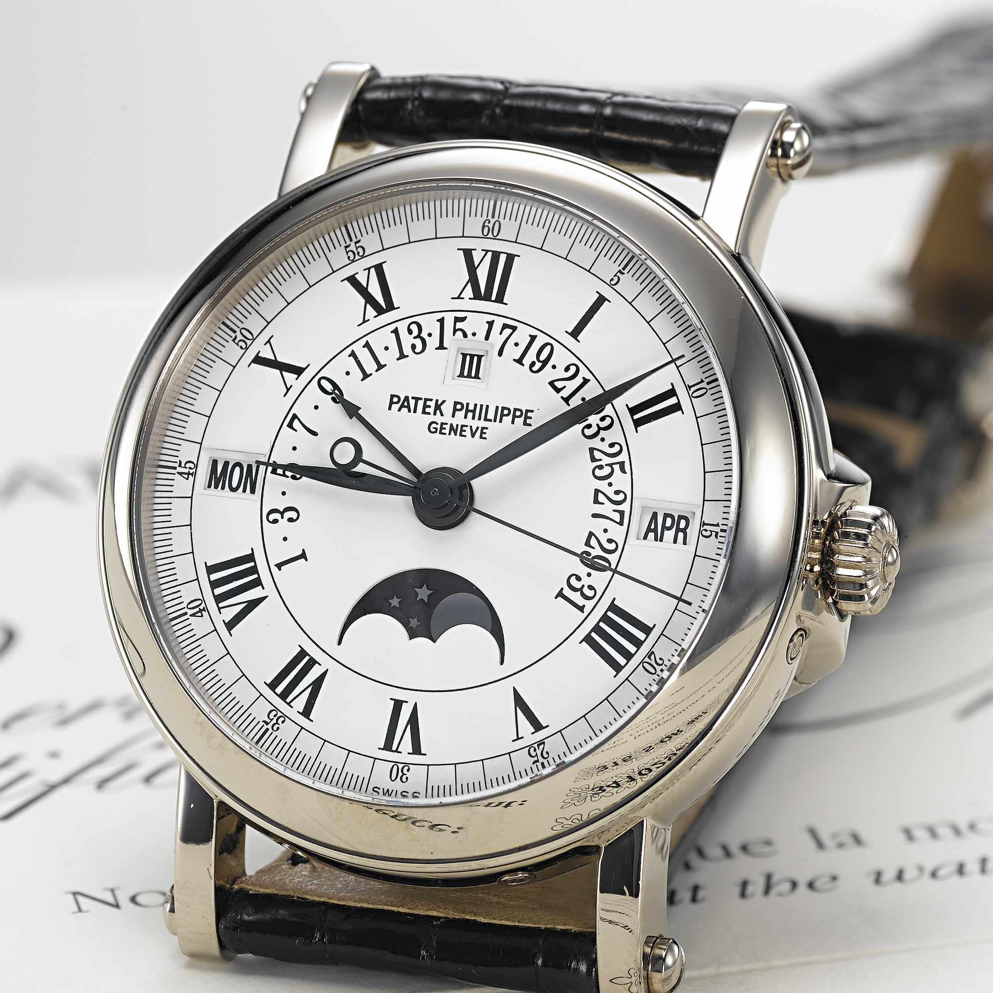 PATEK PHILIPPE, A FINE WHITE GOLD AUTOMATIC CENTRE SECONDS RETROGRADE PERPETUAL CALENDAR WRISTWATCH WITH MOON PHASESCIRCA 2003, No. 3.410.292, REF. 5059